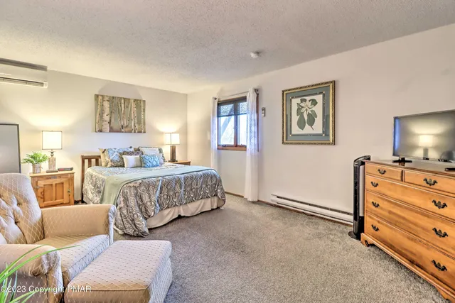 a bedroom with a bed and furniture