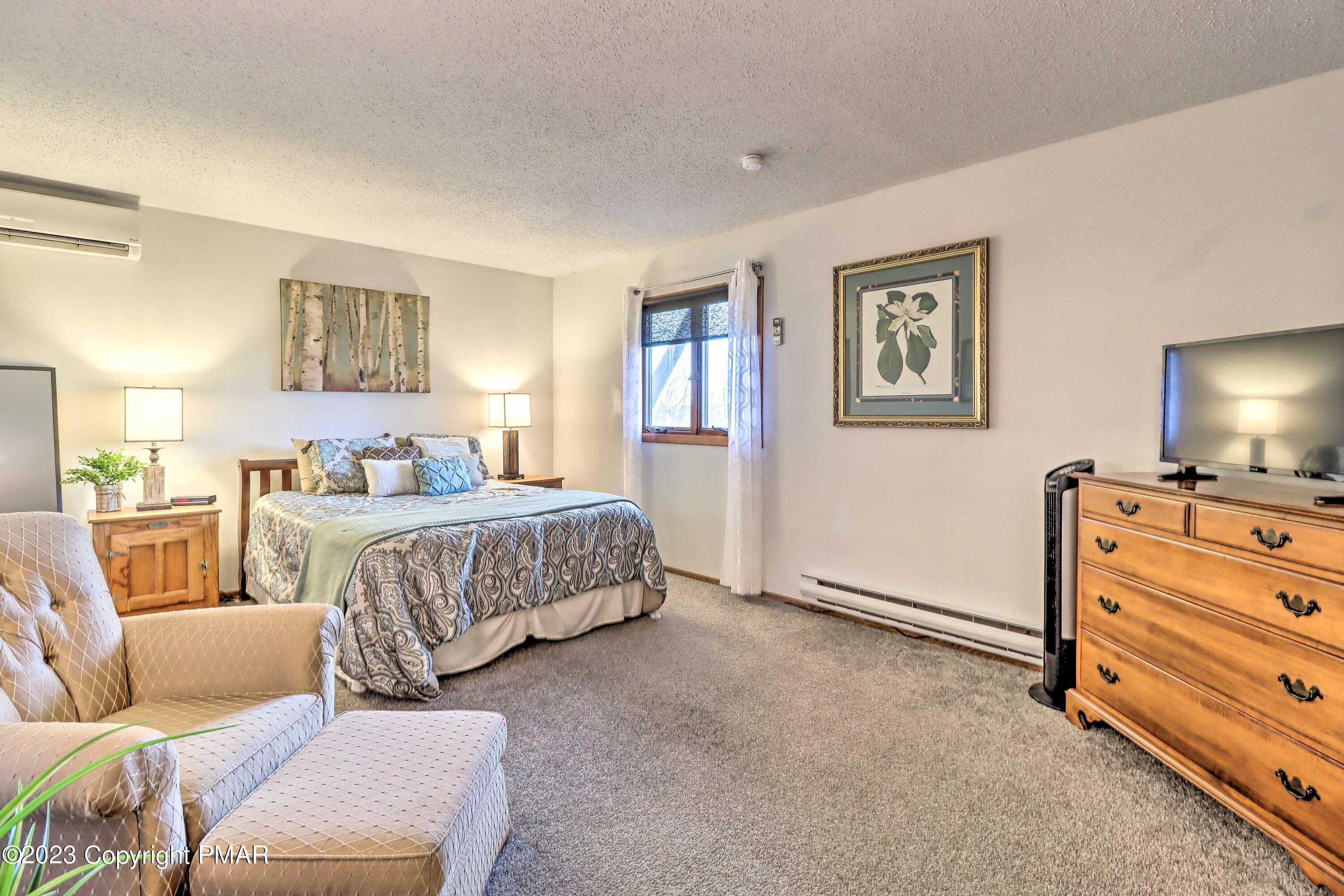 296 Overlook Way Tannersville, PA 18372 - Photo 23 of 44 a bedroom with a bed and furniture