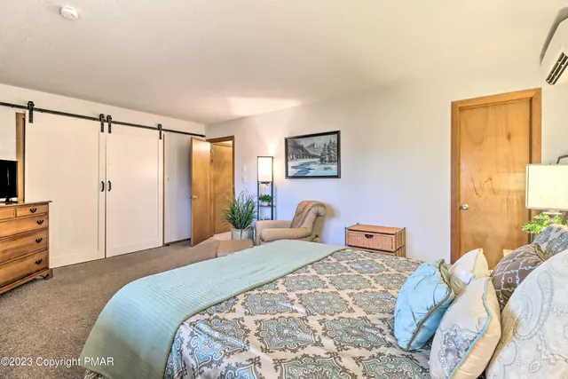 a bedroom with a bed and furniture