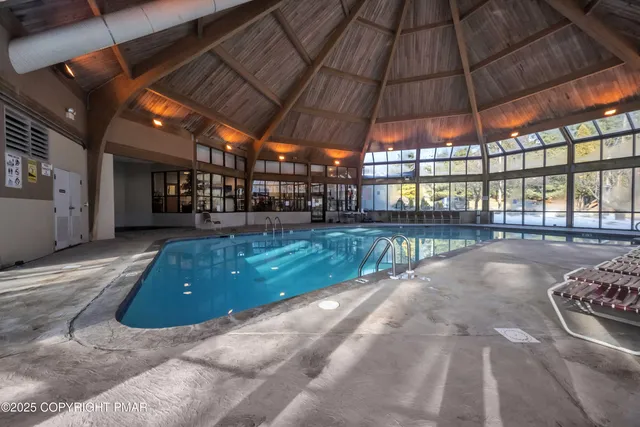 a view of a swimming pool with a patio