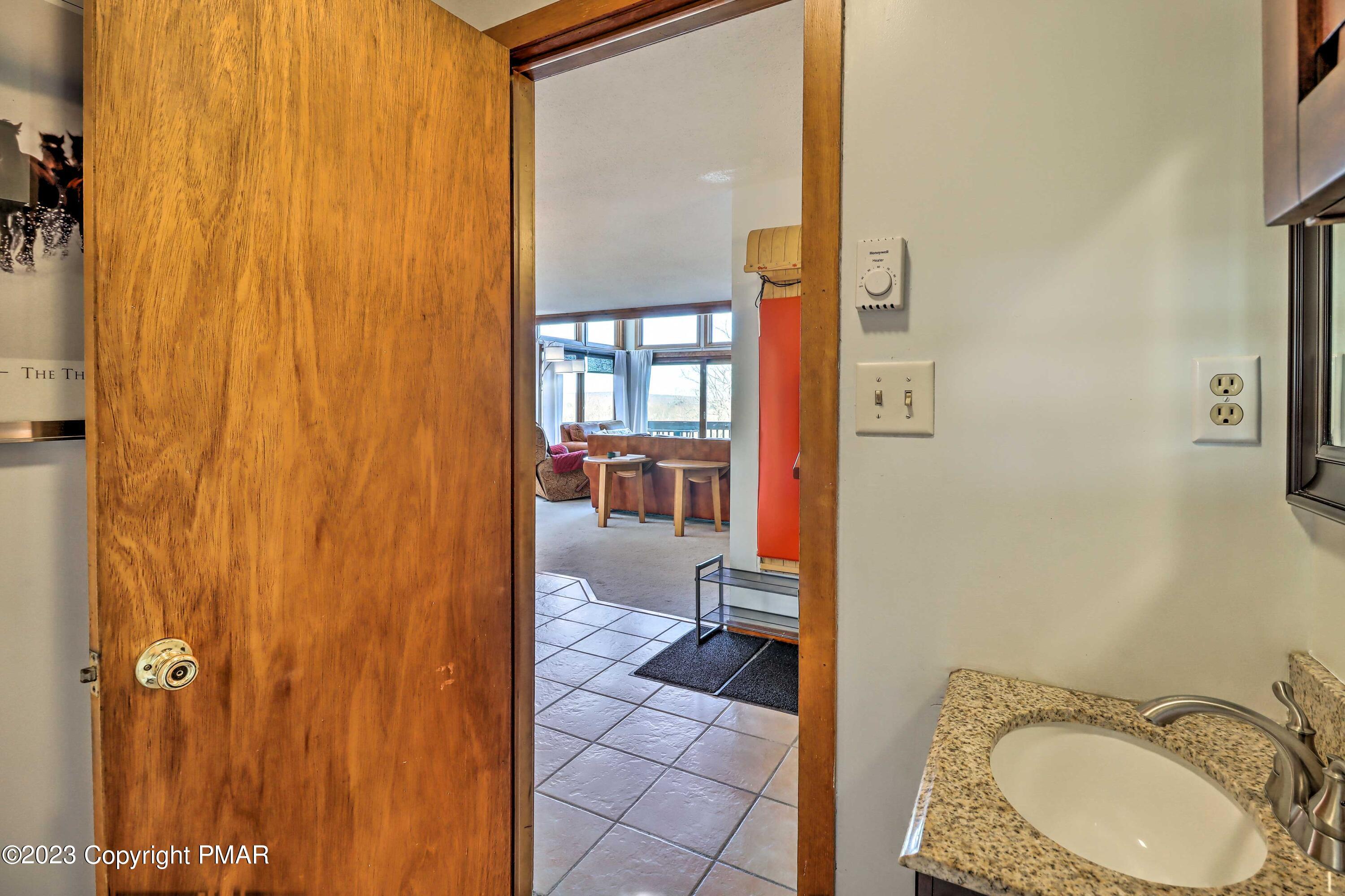296 Overlook Way Tannersville, PA 18372 - Photo 5 of 44 a bathroom with a sink and a mirror