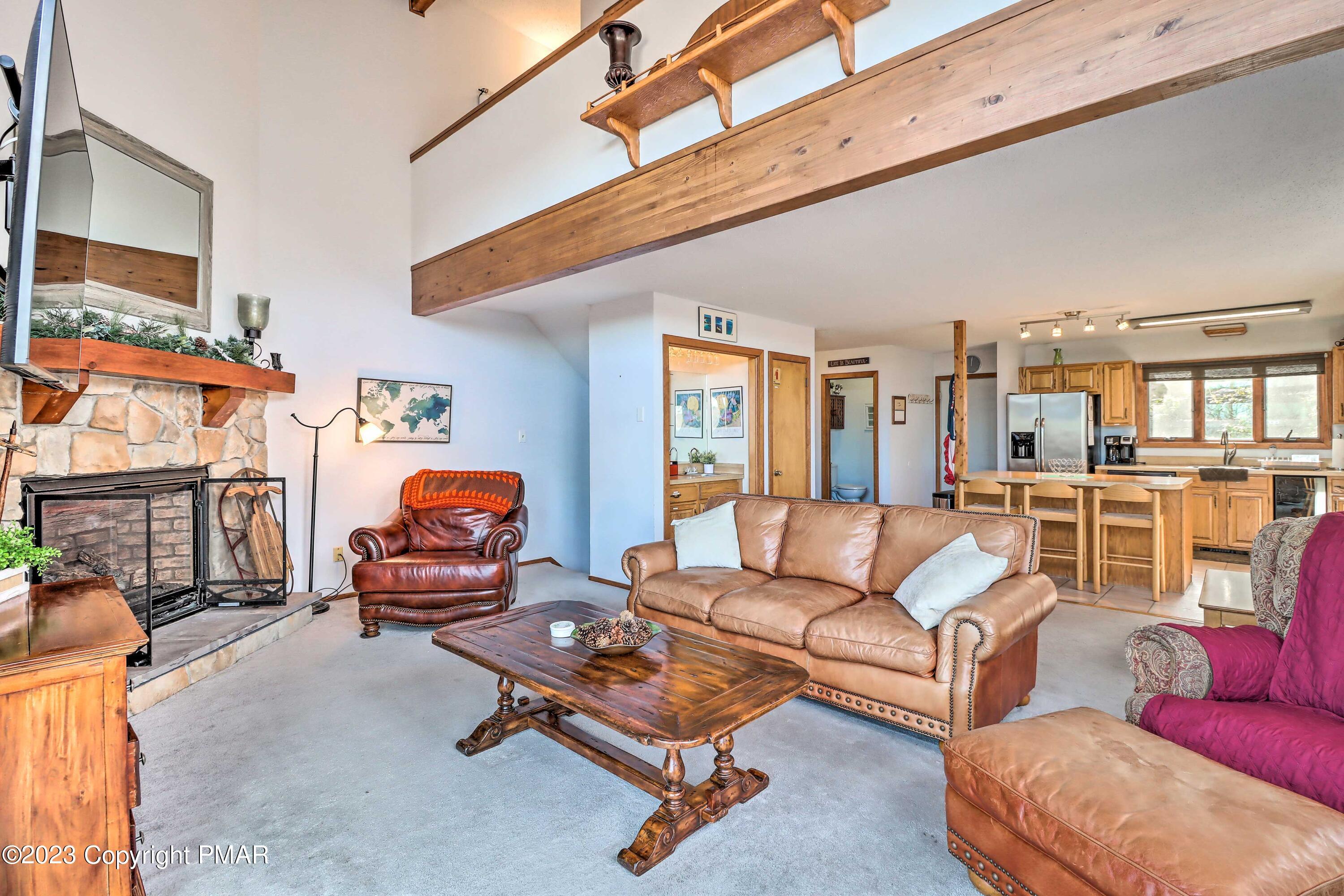 296 Overlook Way Tannersville, PA 18372 - Photo 10 of 44 a living room with furniture a rug and a large window