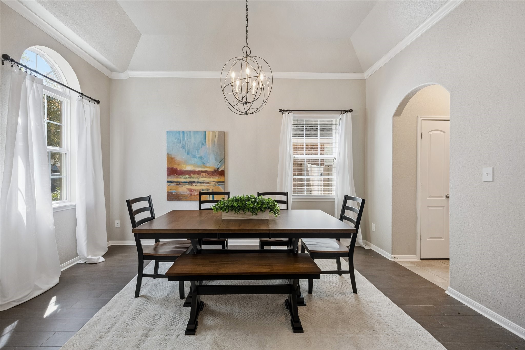 5922 Watford Bend Rosenberg, TX 77471 - Photo 12 of 34 DINING ROOM Flanking the entry at left is the dining area boasting a vaulted ceiling with a highend globe pendant light. Door at right leads to a generous pantry.