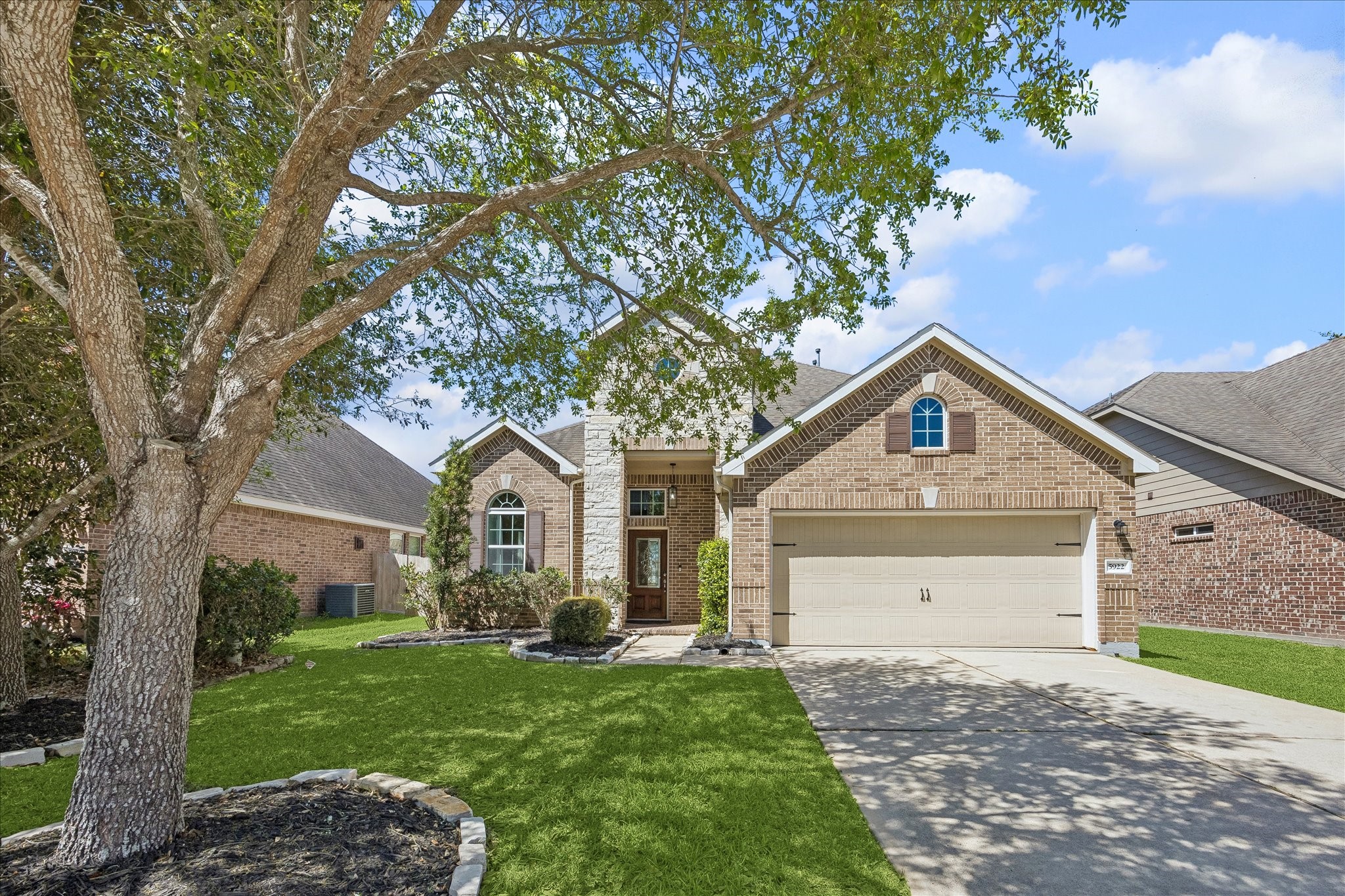 5922 Watford Bend Rosenberg, TX 77471 - Photo 16 of 34 a front view of a house with a yard and garage