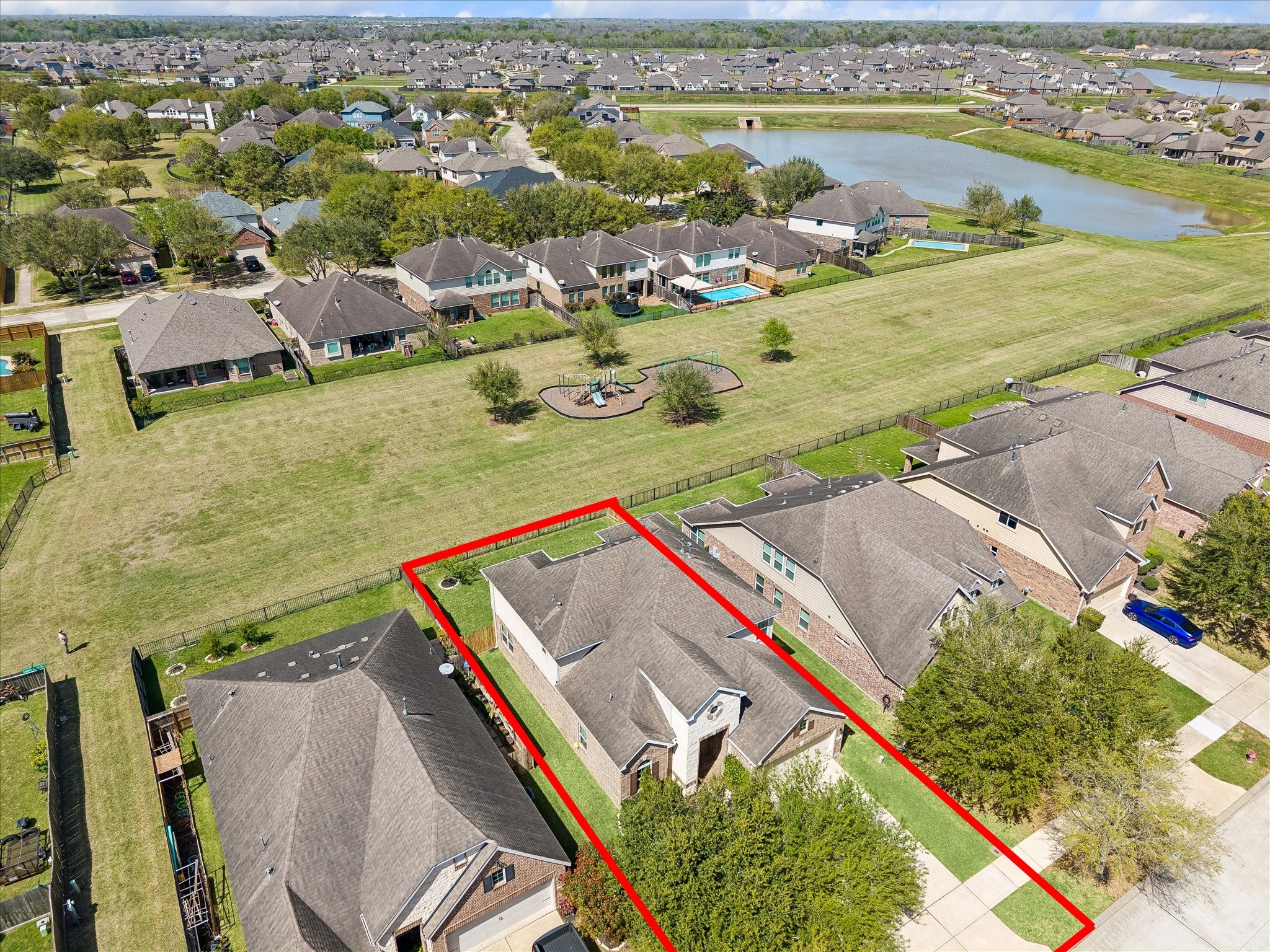 5922 Watford Bend Rosenberg, TX 77471 - Photo 6 of 34 AERIAL VIEW From this birdseye perspective, a view of the greenbelt behind the home and one of the community lakes can be appreciated. Zoned to esteemed Lamar CISD schools.
From this birdseye perspective, a view of the greenbelt and one of the community lakes is appreciated.