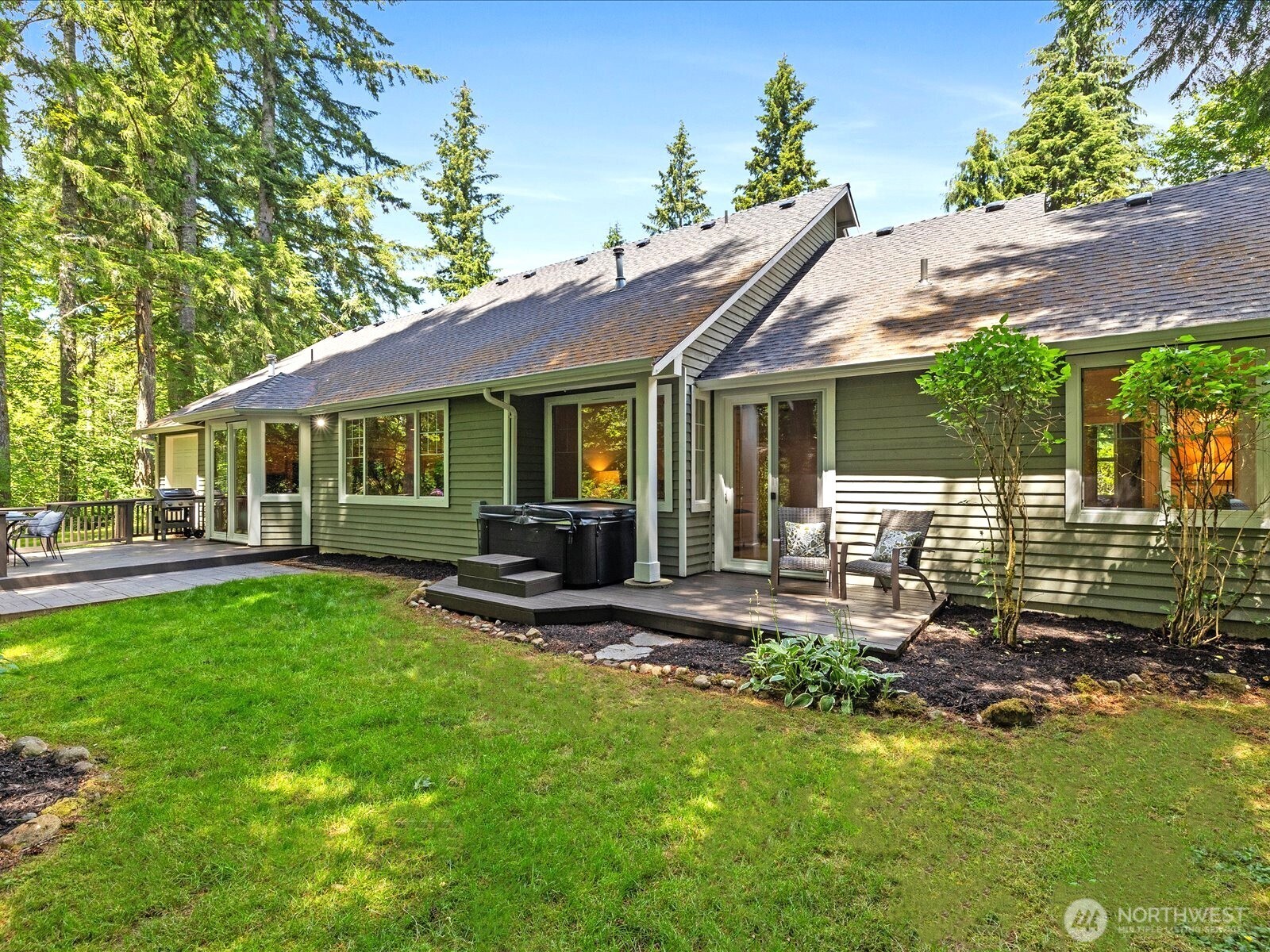 33606 Northeast Lake Joy Road Carnation, WA 98014 - Photo 35 of 40 a view of a house with a yard porch and sitting area