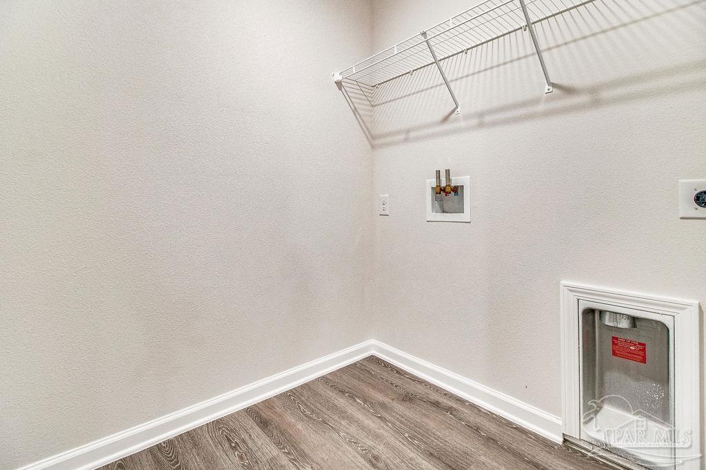4378 Redbay Court Pace, FL 32571 - Photo 25 of 25 a view of a small space with wooden floor and a window