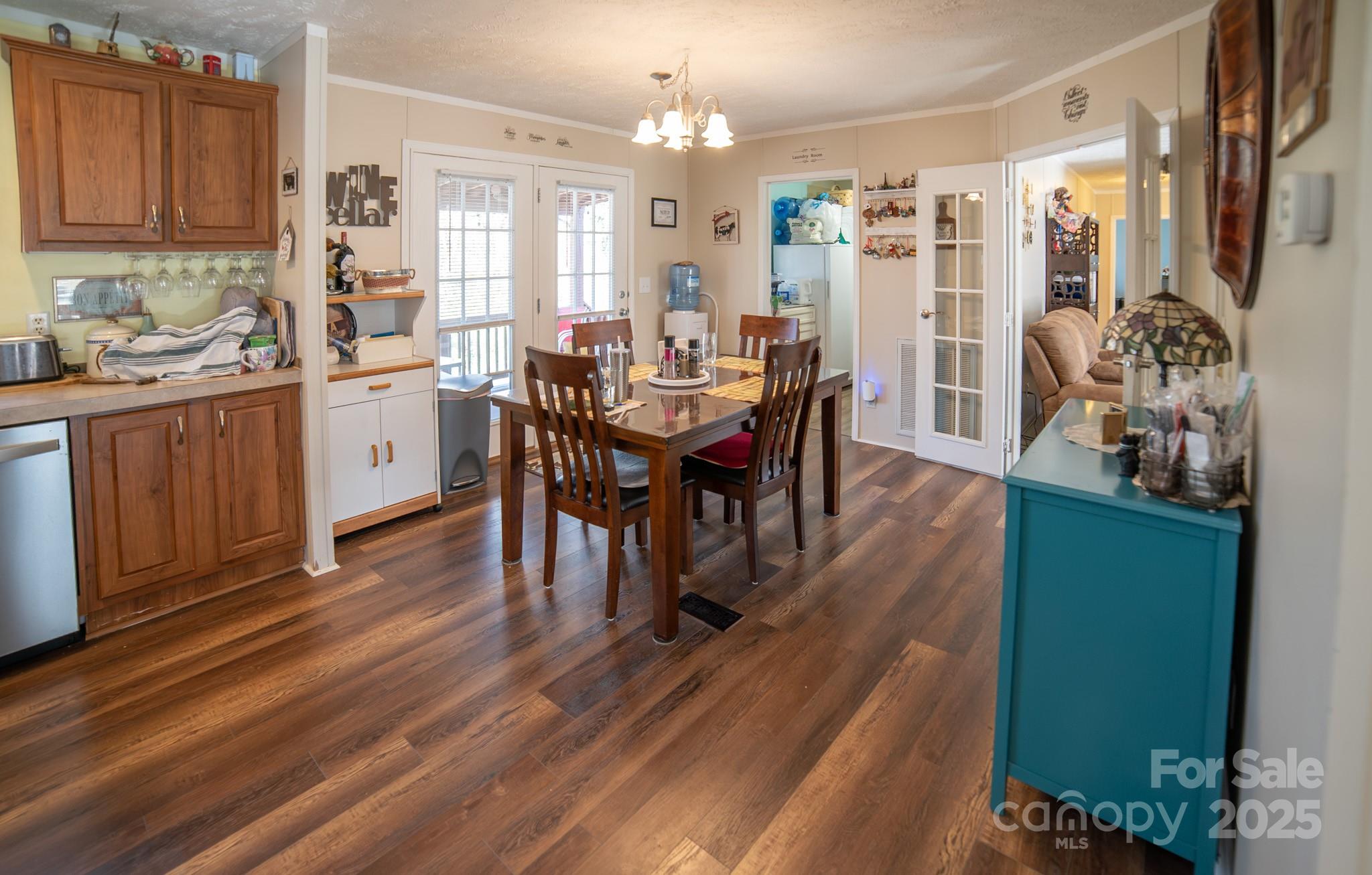 3122 Vance Denton Road Morganton, NC 28655 - Photo 11 of 42 a view of a dining room with furniture and chandelier