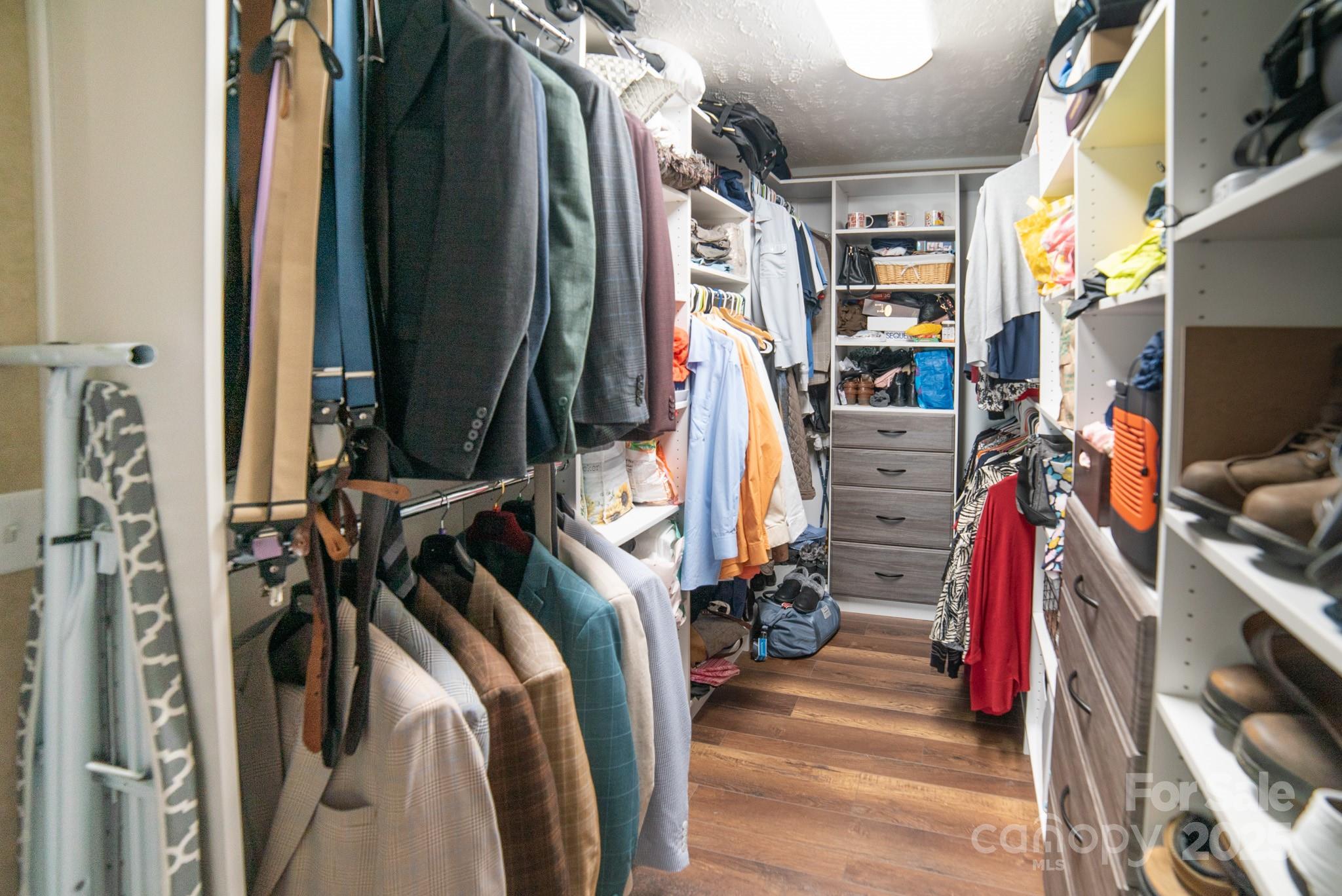 3122 Vance Denton Road Morganton, NC 28655 - Photo 20 of 42 a view of walk in closet with clothes