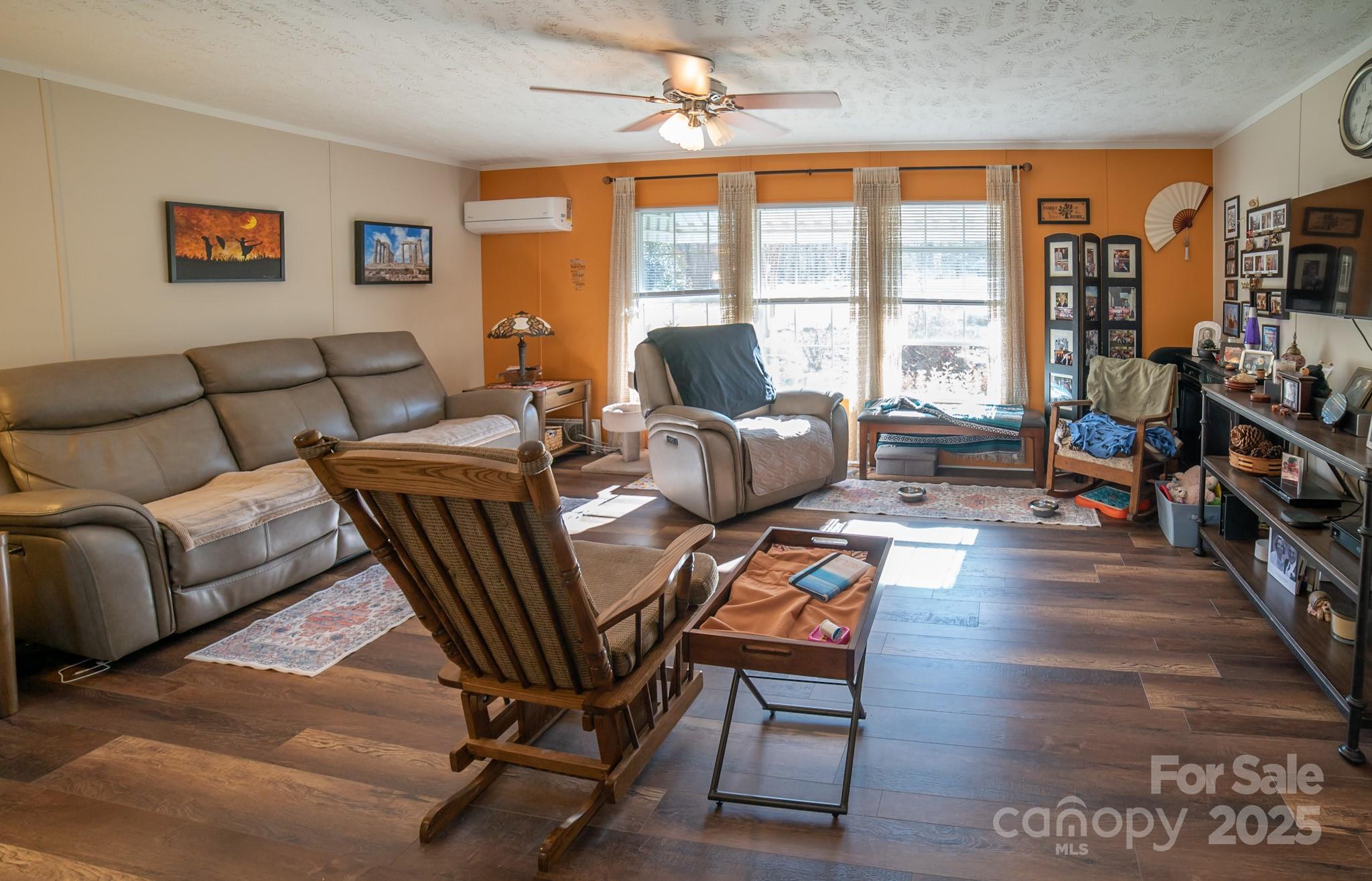 3122 Vance Denton Road Morganton, NC 28655 - Photo 2 of 42 a living room with furniture a flat screen tv and a large window