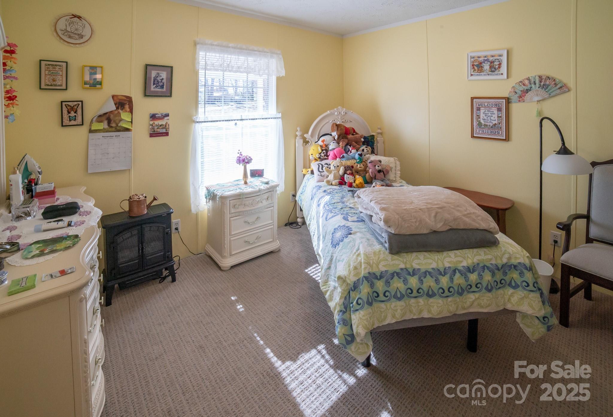3122 Vance Denton Road Morganton, NC 28655 - Photo 21 of 42 a bed room with a bed and furniture