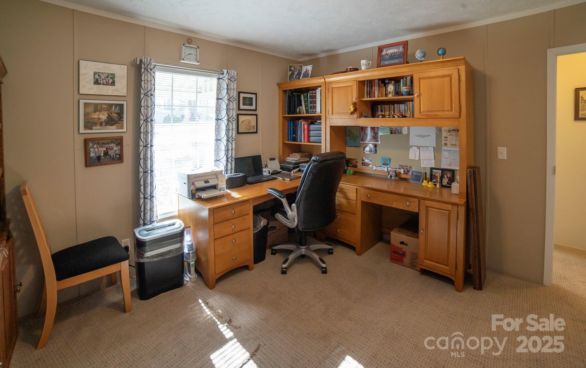 3122 Vance Denton Road Morganton, NC 28655 - Photo 23 of 42 a view of a workspace with furniture and a window
