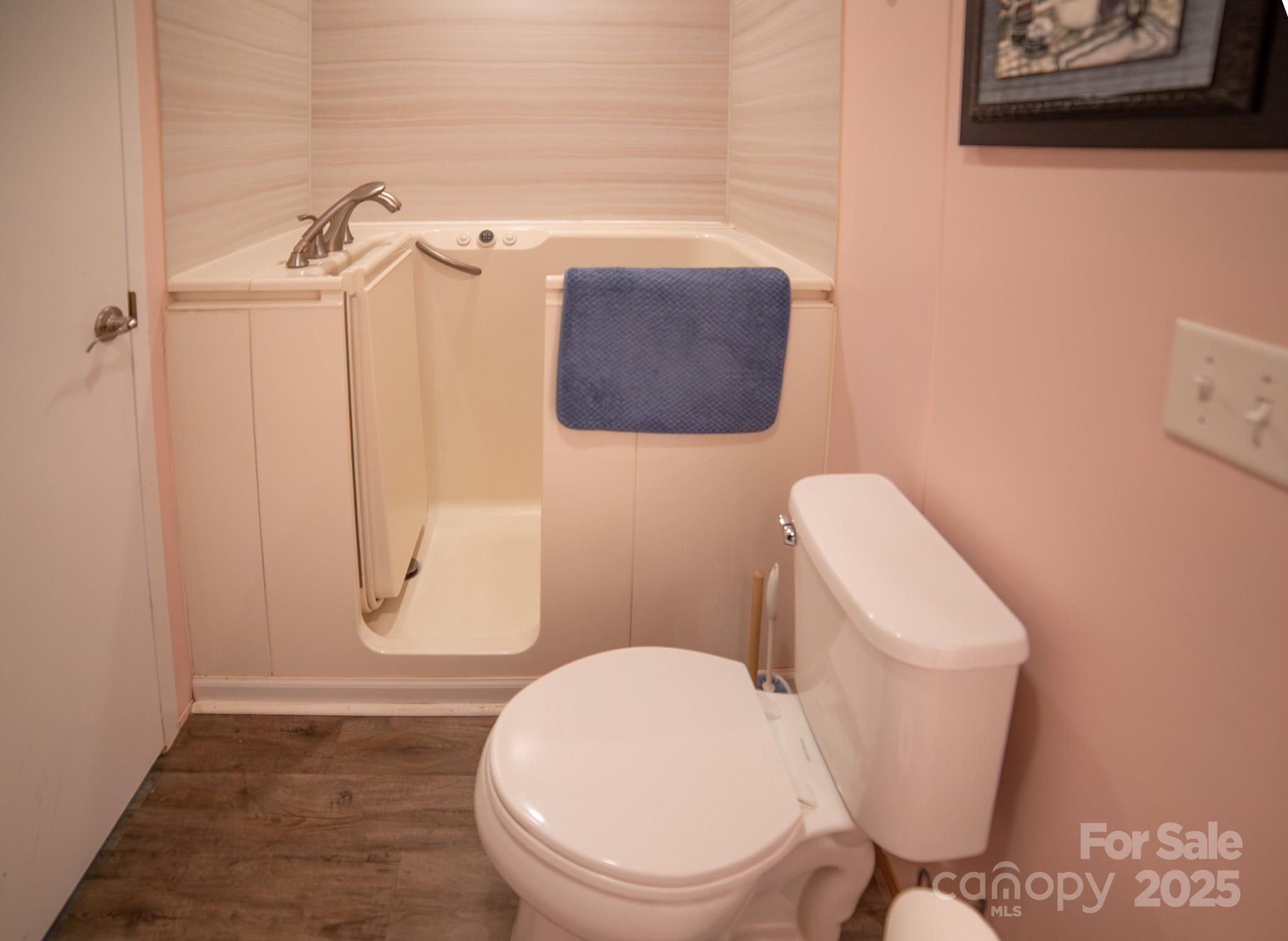 3122 Vance Denton Road Morganton, NC 28655 - Photo 25 of 42 a white toilet sitting next to a shower