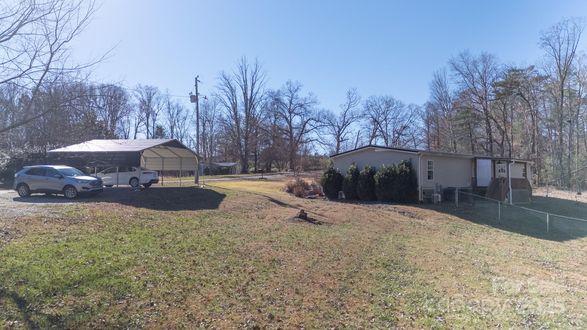 3122 Vance Denton Road Morganton, NC 28655 - Photo 40 of 42 a view of patio with a table and chairs under an umbrella