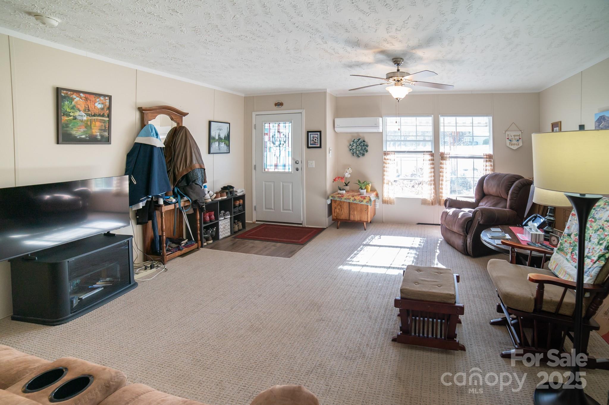 3122 Vance Denton Road Morganton, NC 28655 - Photo 4 of 42 a living room with furniture a window and a flat screen tv
