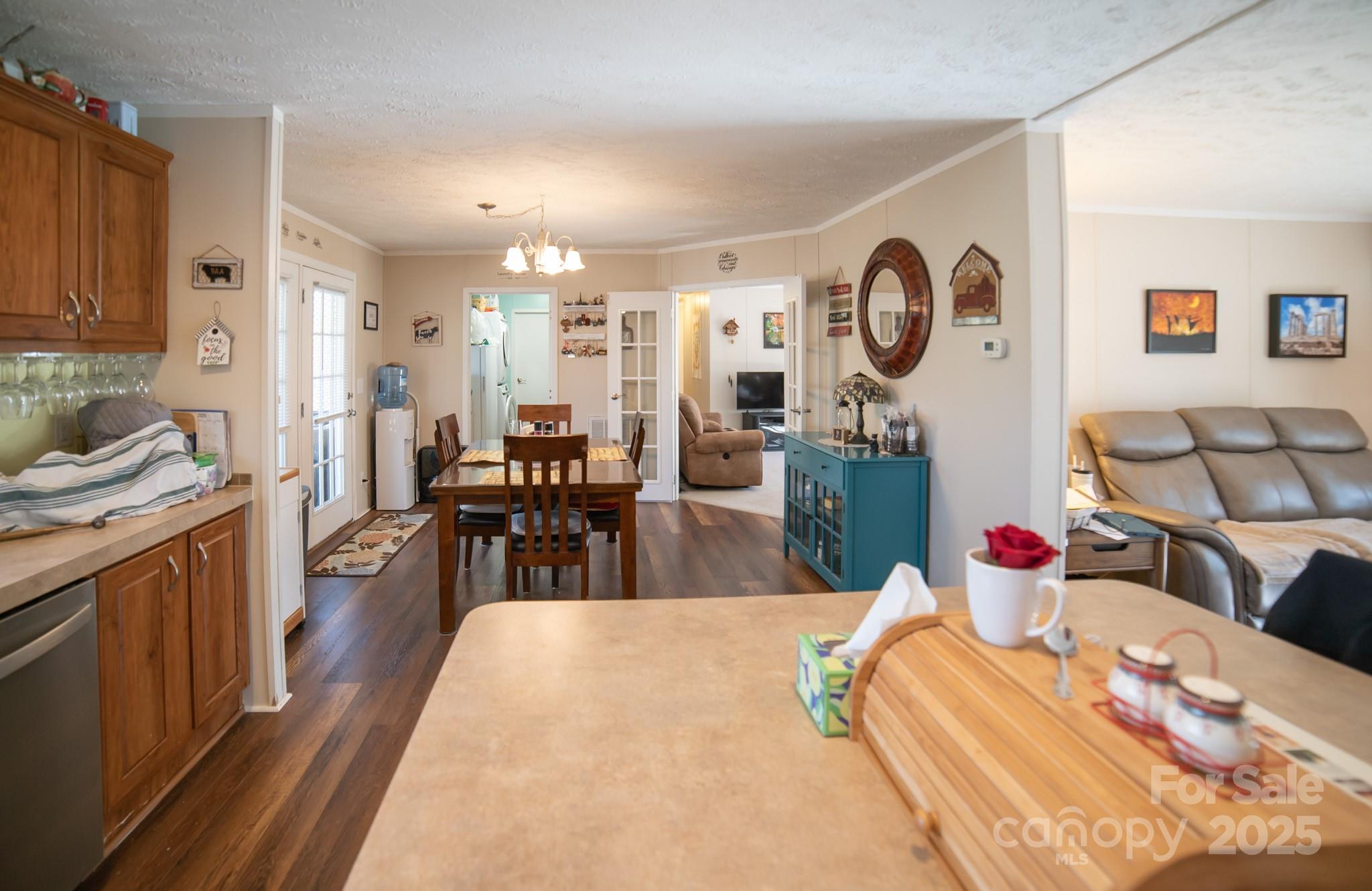 3122 Vance Denton Road Morganton, NC 28655 - Photo 6 of 42 a living room with lots of furniture and chandelier