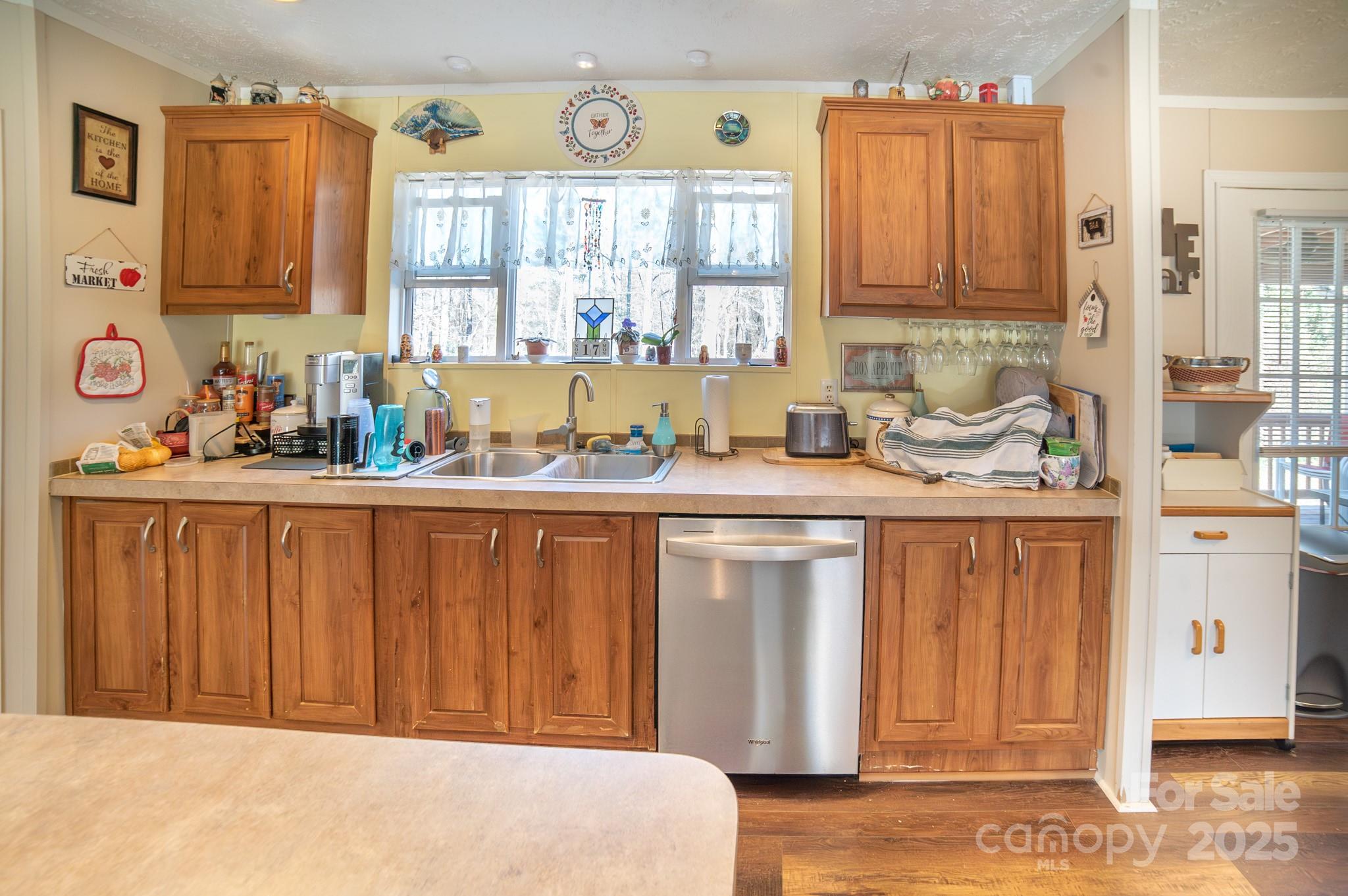 3122 Vance Denton Road Morganton, NC 28655 - Photo 8 of 42 a kitchen with stainless steel appliances a refrigerator sink and cabinets