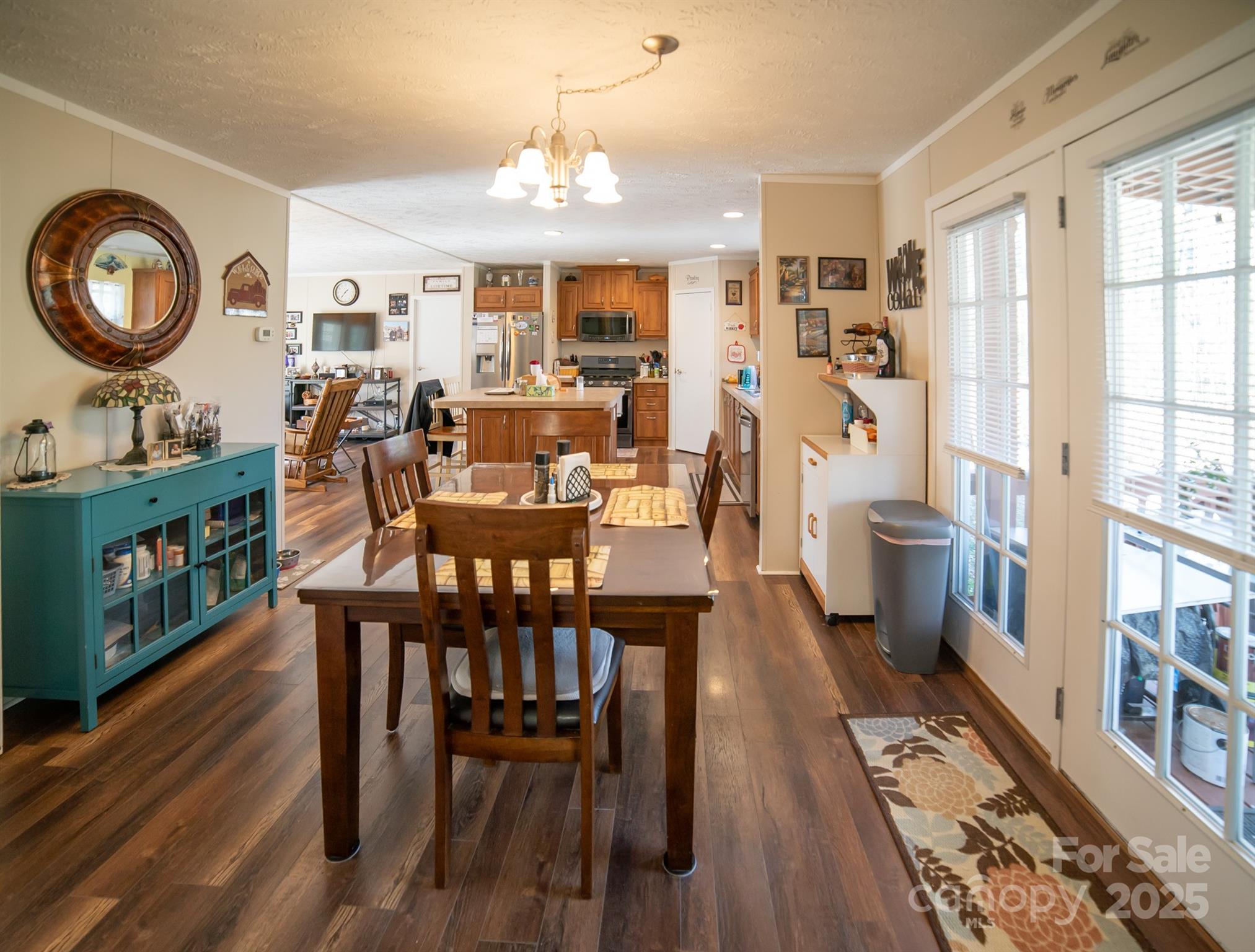 3122 Vance Denton Road Morganton, NC 28655 - Photo 10 of 42 a view of a dining room with furniture and chandelier