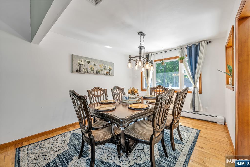 21 Marcia Road Ringwood, NJ 07456 - Photo 9 of 42 a view of a dining room with furniture window and wooden floor