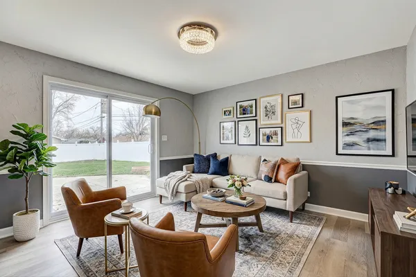 a living room with furniture and a large window
