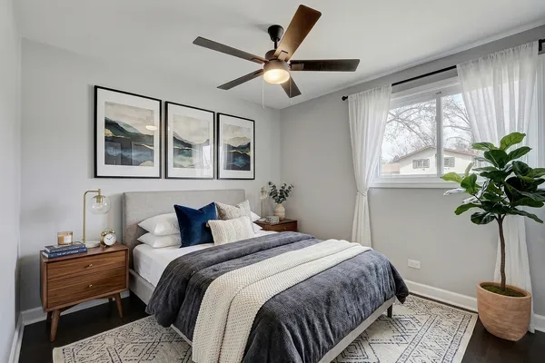 a bedroom with a large bed and a window