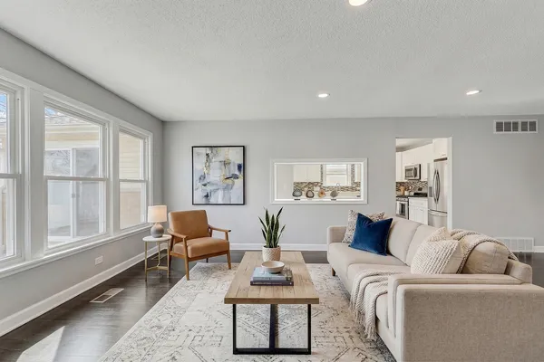 a living room with furniture and a large window