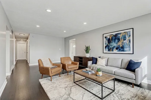 a living room with furniture and a rug