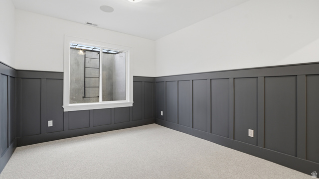 1682 North 1950 W Street, Unit 9 Provo, UT 84604 - Photo 53 of 84 Room featuring board and batten wall paneling, light-colored carpeting, a white-framed window, and recessed ceiling lighting