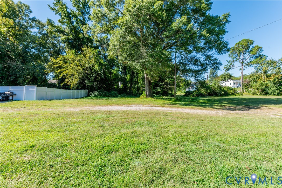 1304 Arlington Road Hopewell, VA 23860 - Photo 2 of 16 a view of a swimming pool with an outdoor space and seating area