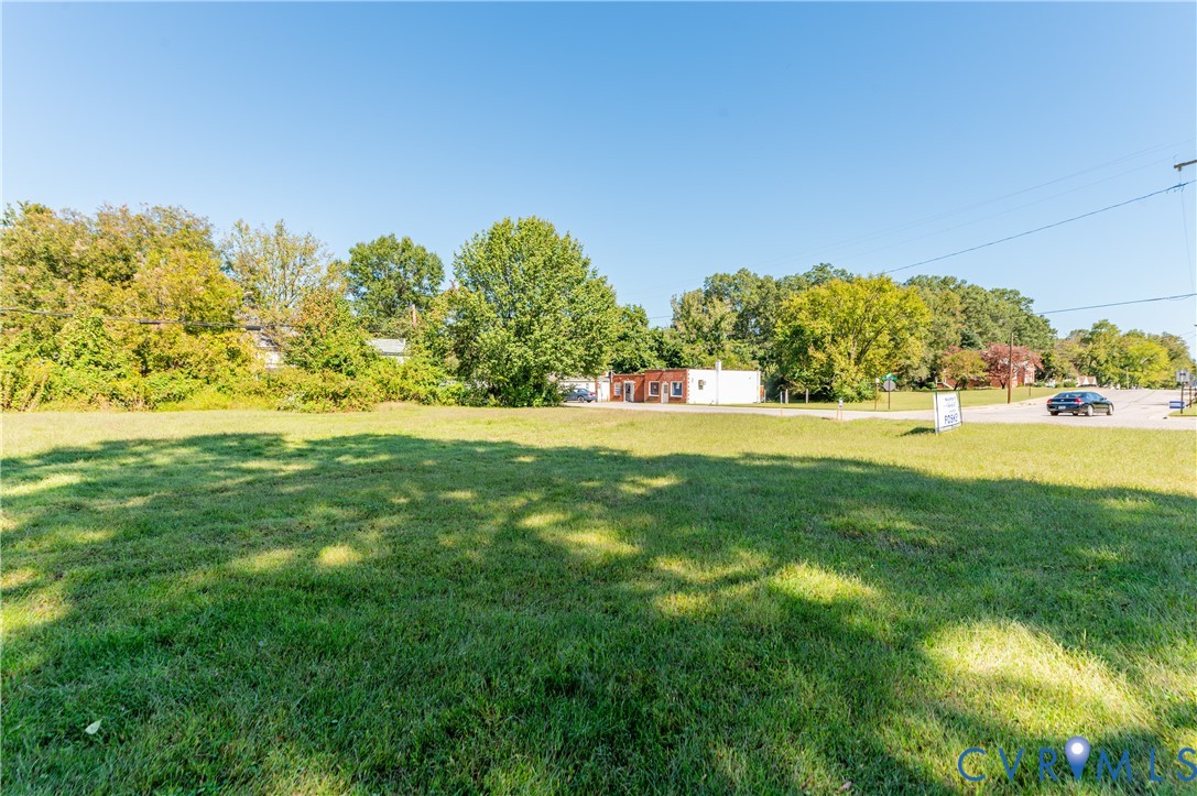 1304 Arlington Road Hopewell, VA 23860 - Photo 8 of 16 a garden with trees in the background