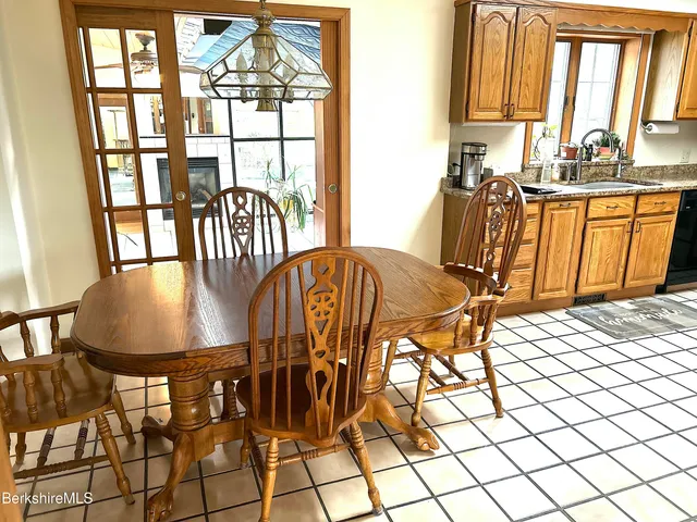 a kitchen with stainless steel appliances granite countertop a stove sink and cabinets