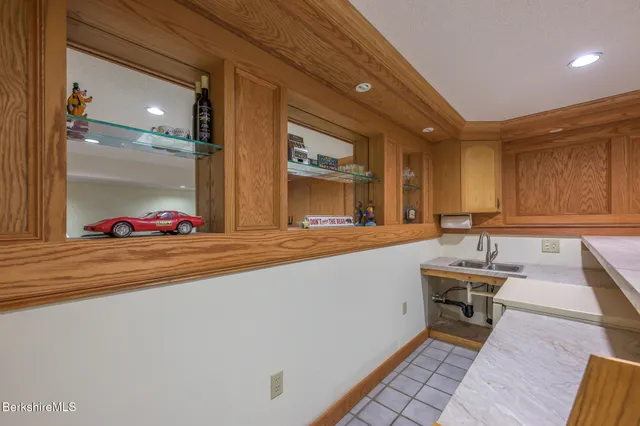 a front view of house with a garden