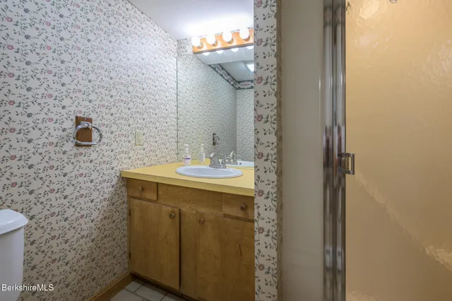 an aerial view of a house with a yard swimming pool and outdoor seating