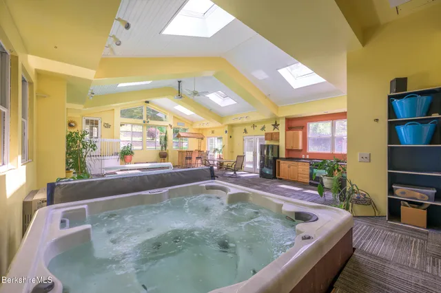 a lobby with furniture and floor to ceiling window