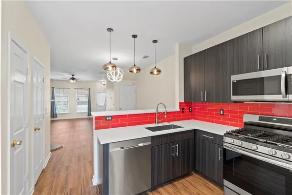 a kitchen with a sink and a stove