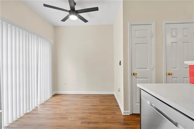 a view of a room with wooden floor and staircase