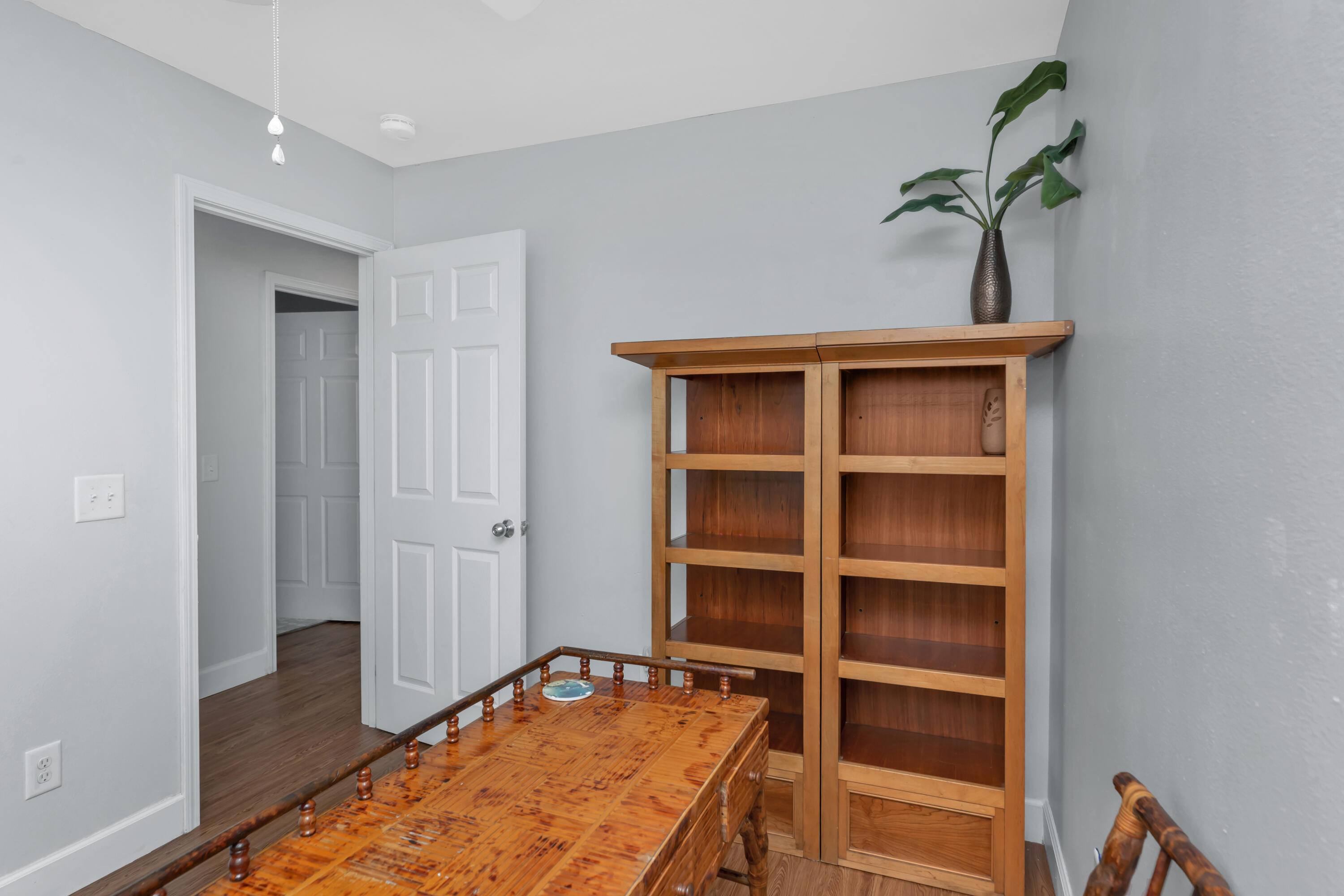 79 6th Street Santa Rosa Beach, FL 32459 - Photo 11 of 42 a view of a hallway with closet and wooden floor