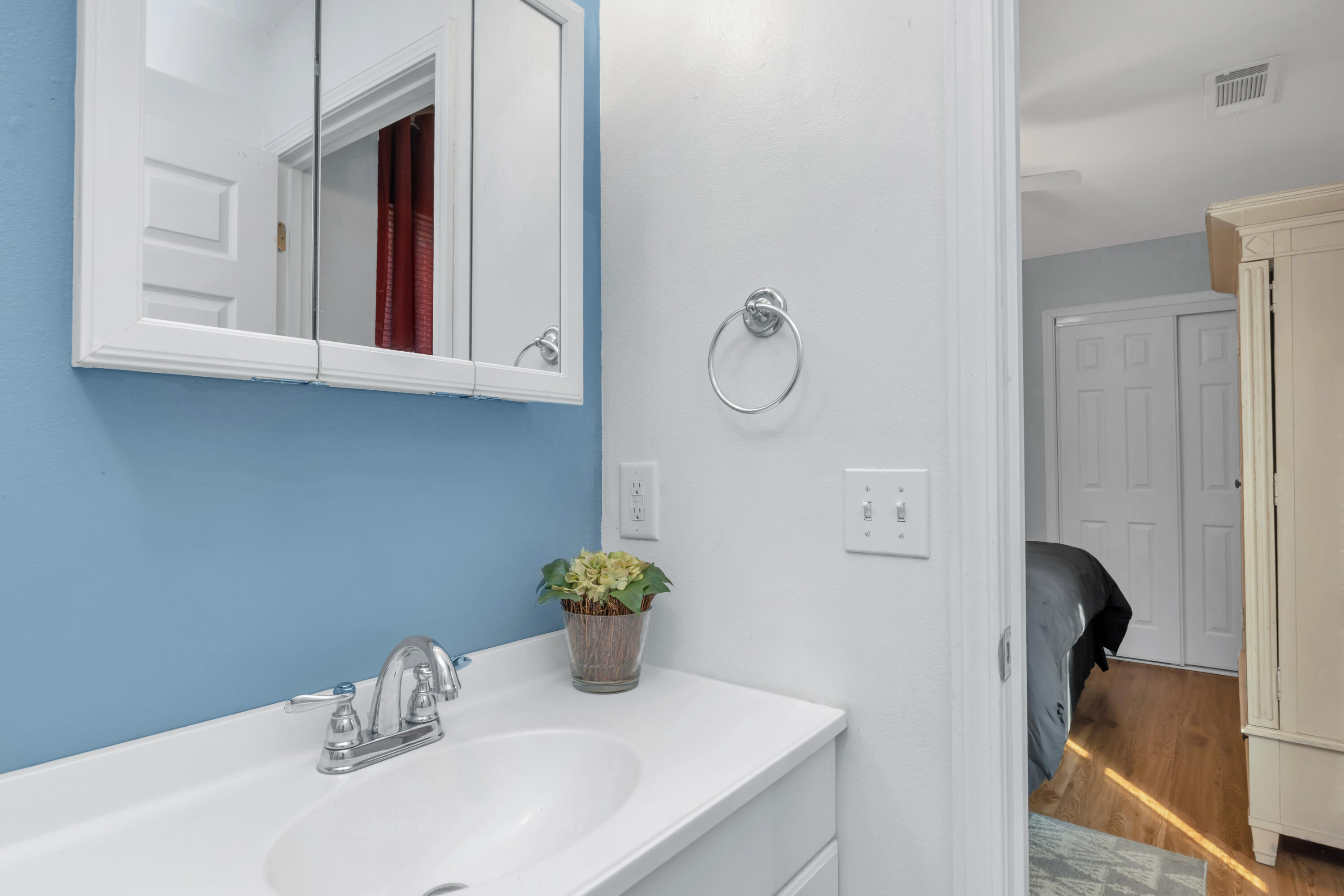 79 6th Street Santa Rosa Beach, FL 32459 - Photo 17 of 42 a bathroom with a sink and a mirror