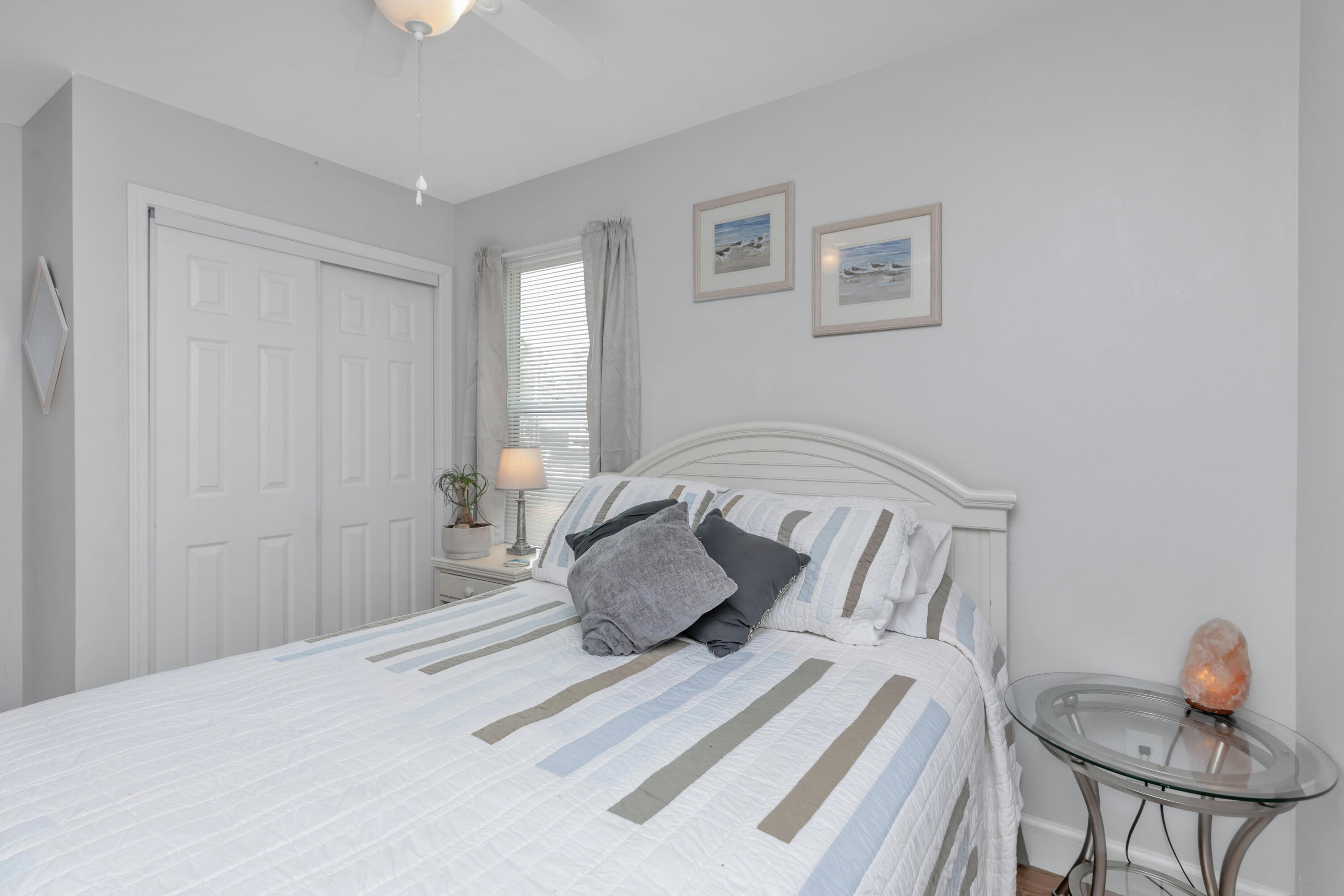 79 6th Street Santa Rosa Beach, FL 32459 - Photo 20 of 42 a bedroom with a bed and window