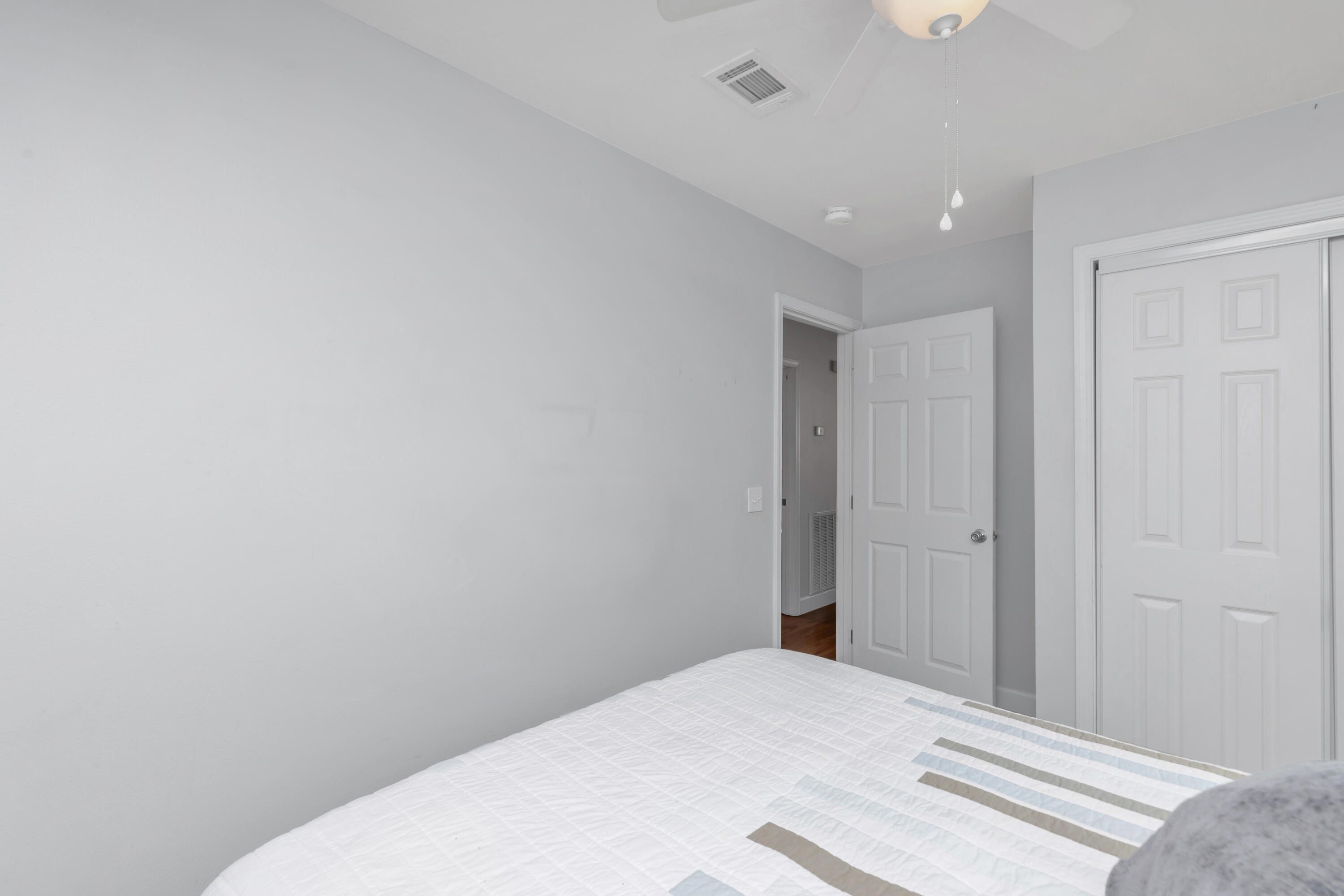 79 6th Street Santa Rosa Beach, FL 32459 - Photo 21 of 42 a bedroom with a bed and a window