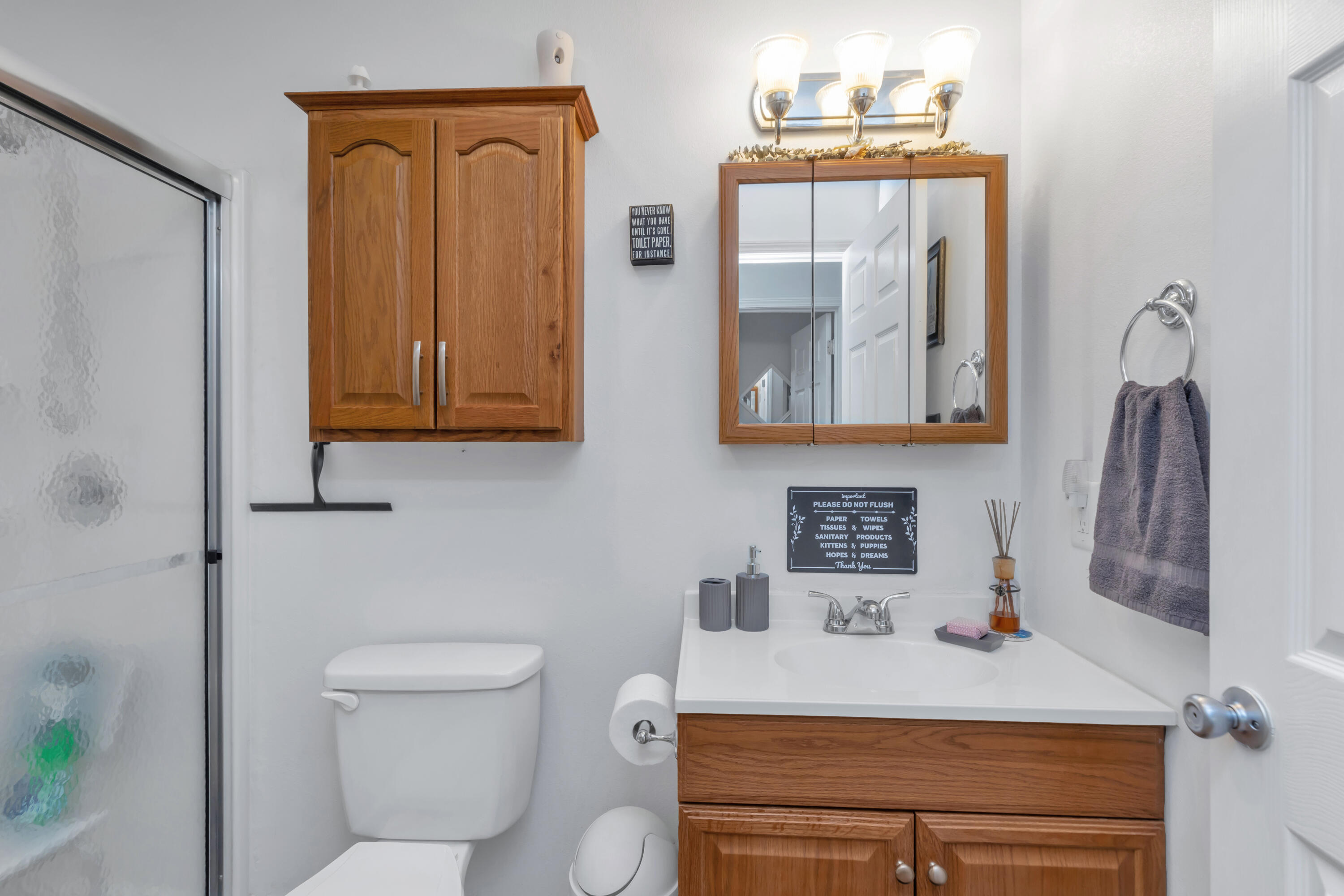 79 6th Street Santa Rosa Beach, FL 32459 - Photo 22 of 42 a bathroom with a sink a toilet and mirror