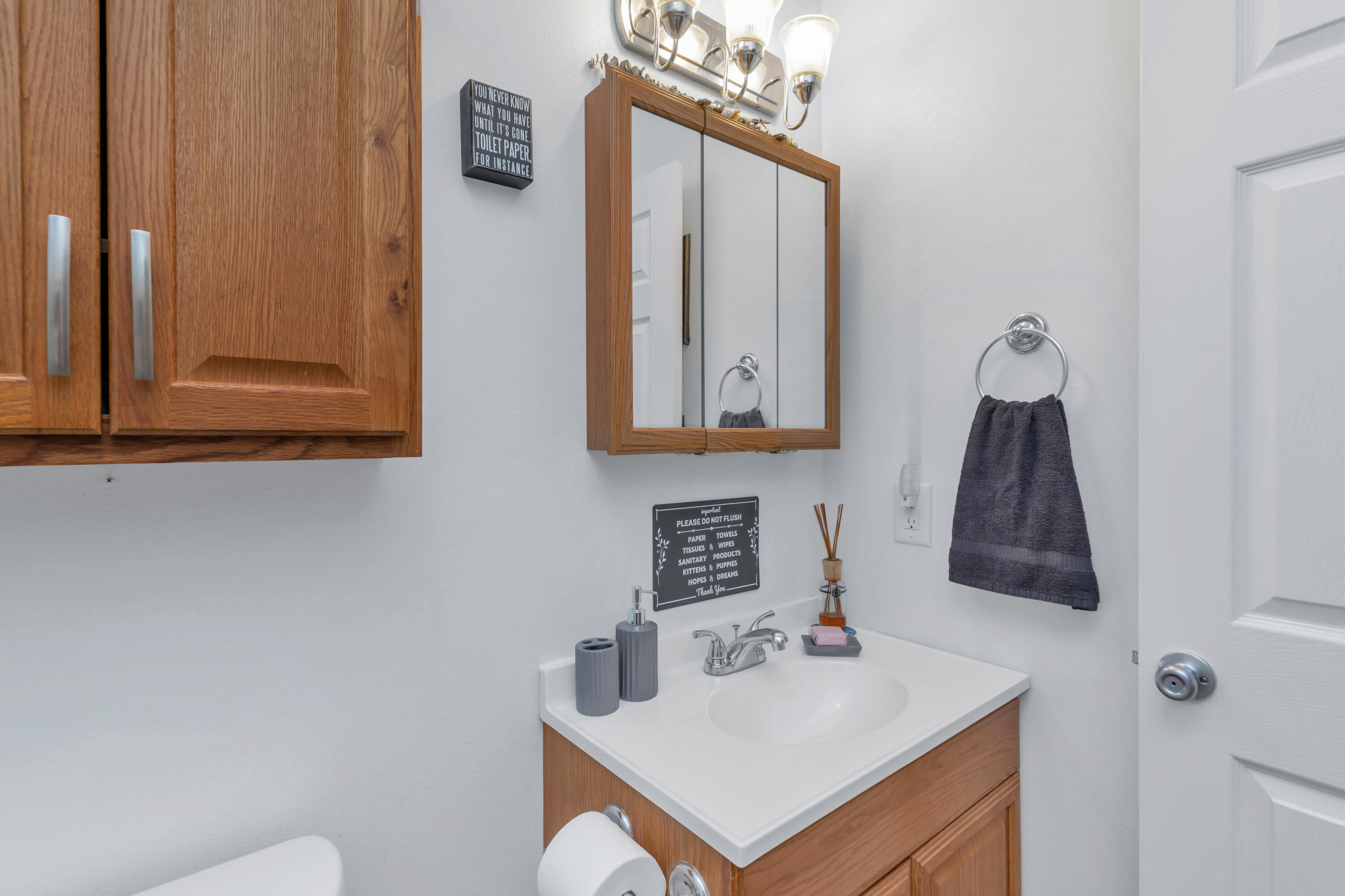 79 6th Street Santa Rosa Beach, FL 32459 - Photo 23 of 42 a bathroom with a sink and a mirror