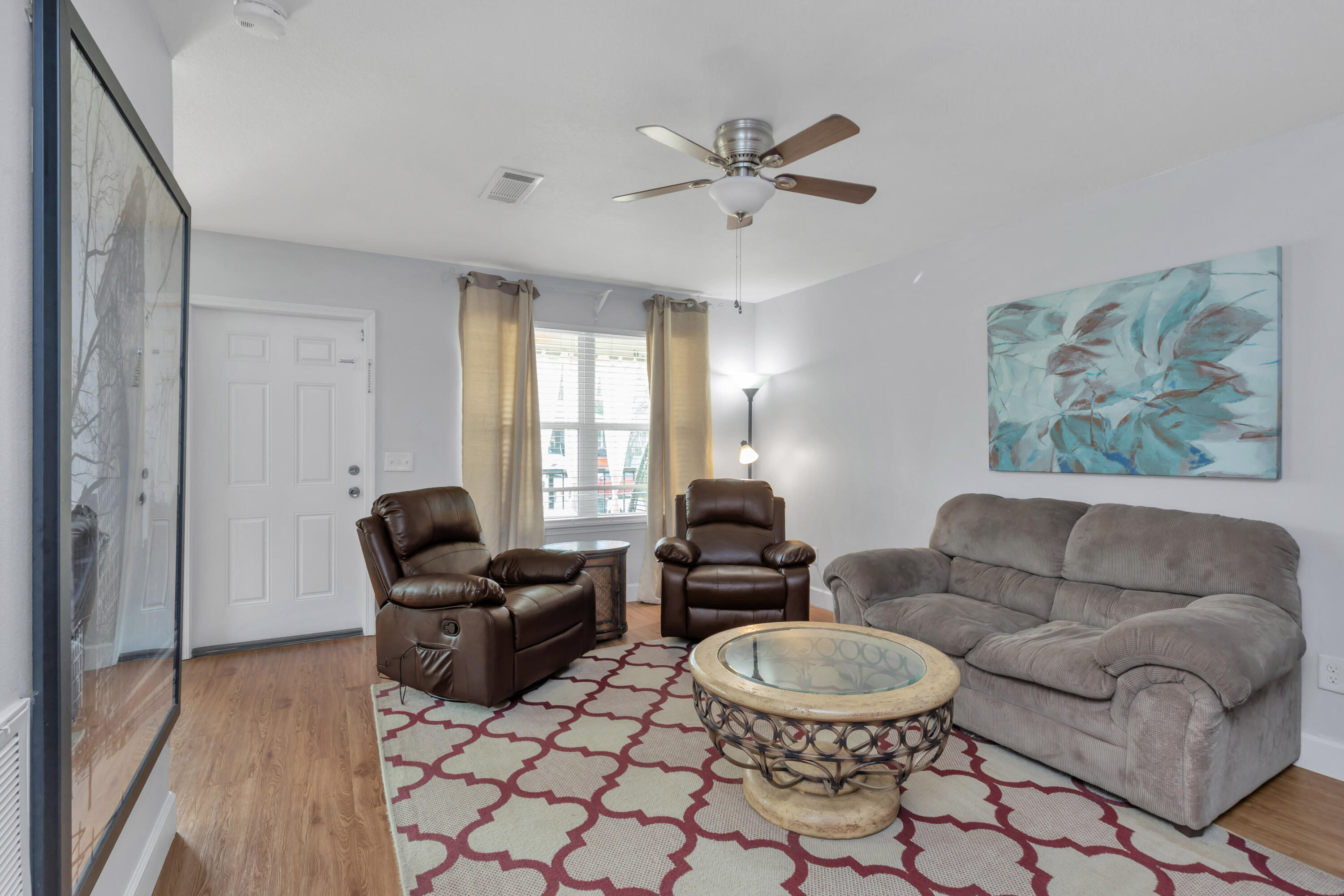 79 6th Street Santa Rosa Beach, FL 32459 - Photo 24 of 42 a living room with furniture and a window