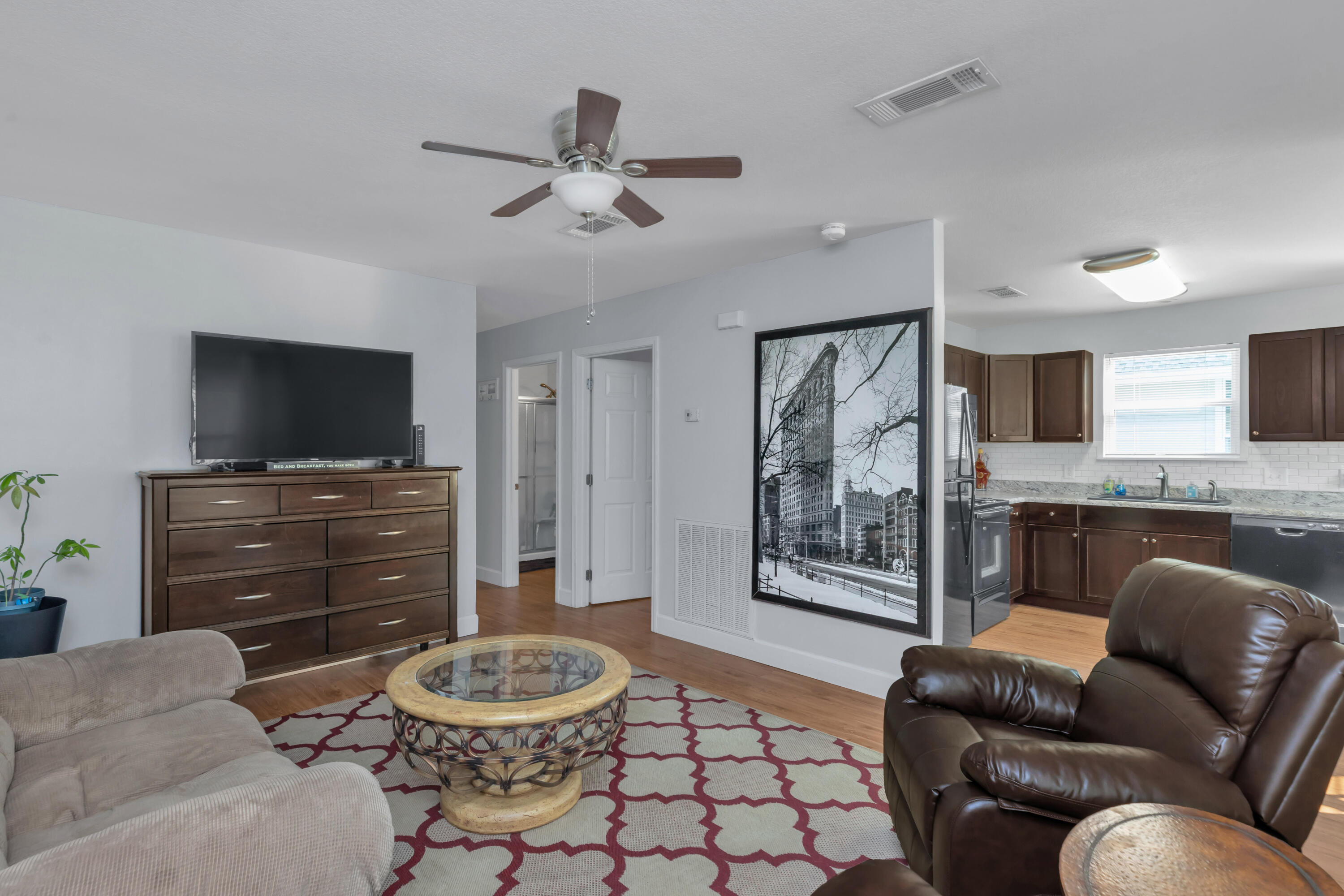 79 6th Street Santa Rosa Beach, FL 32459 - Photo 25 of 42 a living room with furniture and a flat screen tv