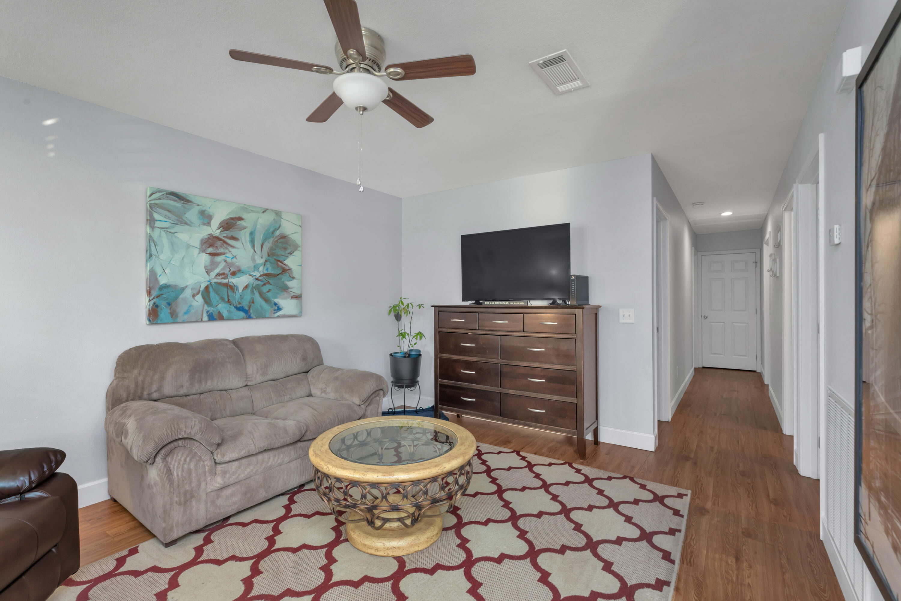 79 6th Street Santa Rosa Beach, FL 32459 - Photo 26 of 42 a living room with furniture and a flat screen tv