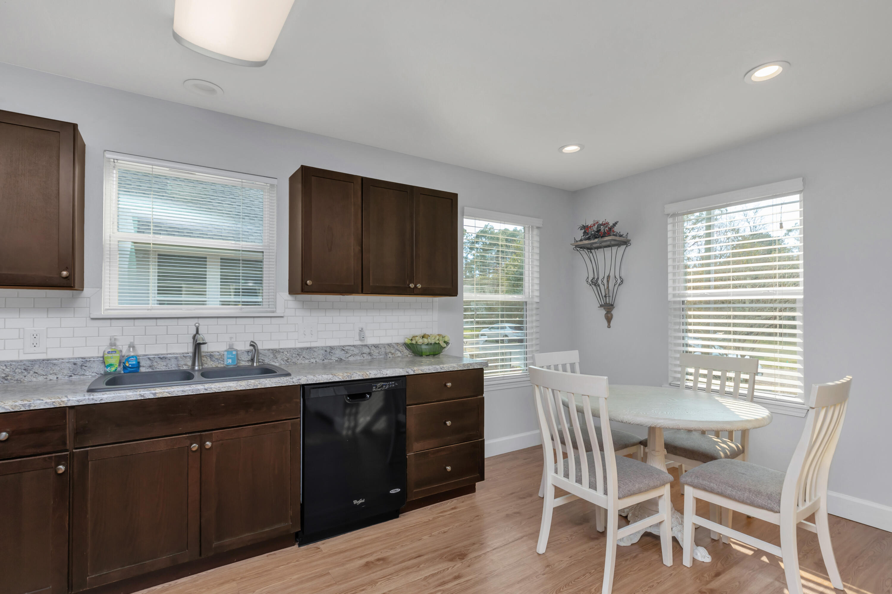 79 6th Street Santa Rosa Beach, FL 32459 - Photo 27 of 42 a kitchen with a table chairs sink and microwave