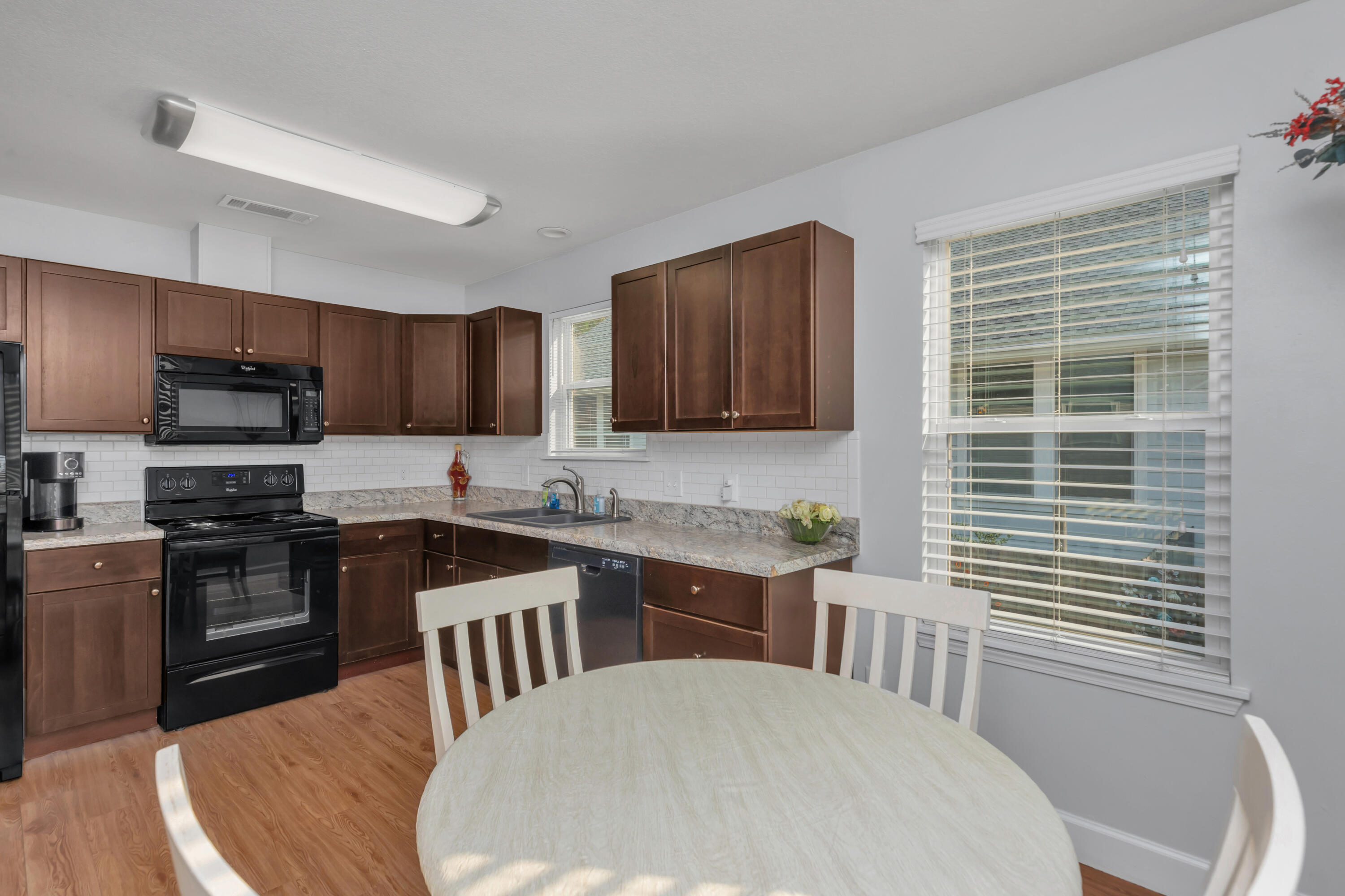 79 6th Street Santa Rosa Beach, FL 32459 - Photo 29 of 42 a kitchen with a sink stove and microwave