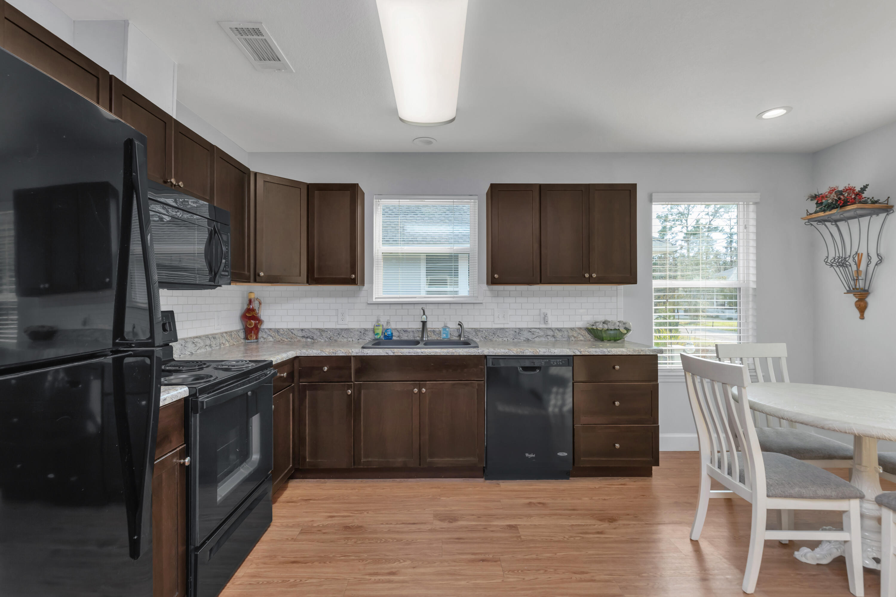 79 6th Street Santa Rosa Beach, FL 32459 - Photo 3 of 42 a kitchen with a sink stove and refrigerator