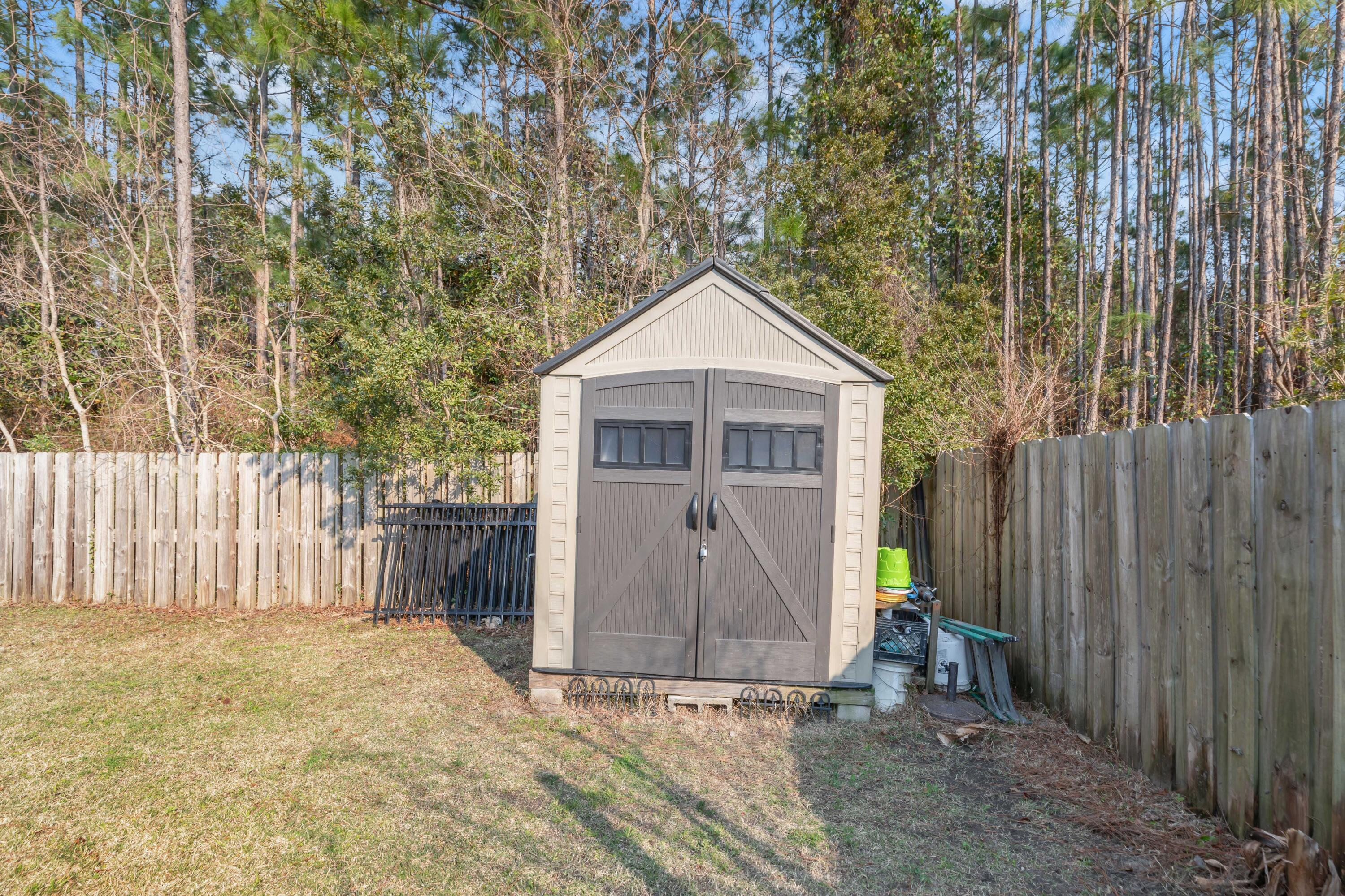 79 6th Street Santa Rosa Beach, FL 32459 - Photo 35 of 42 a house with trees in front of it