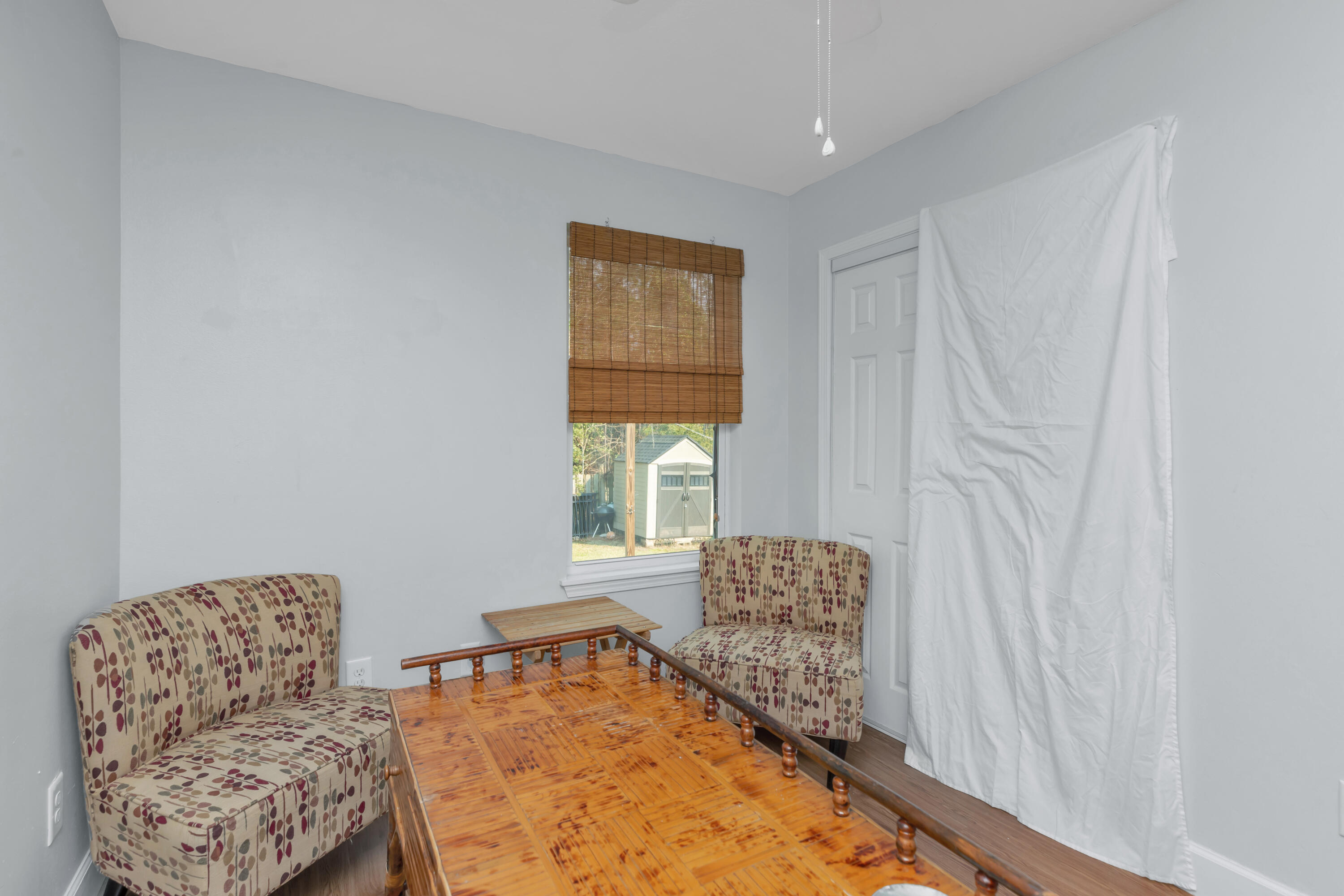 79 6th Street Santa Rosa Beach, FL 32459 - Photo 9 of 42 a bedroom with furniture and a window